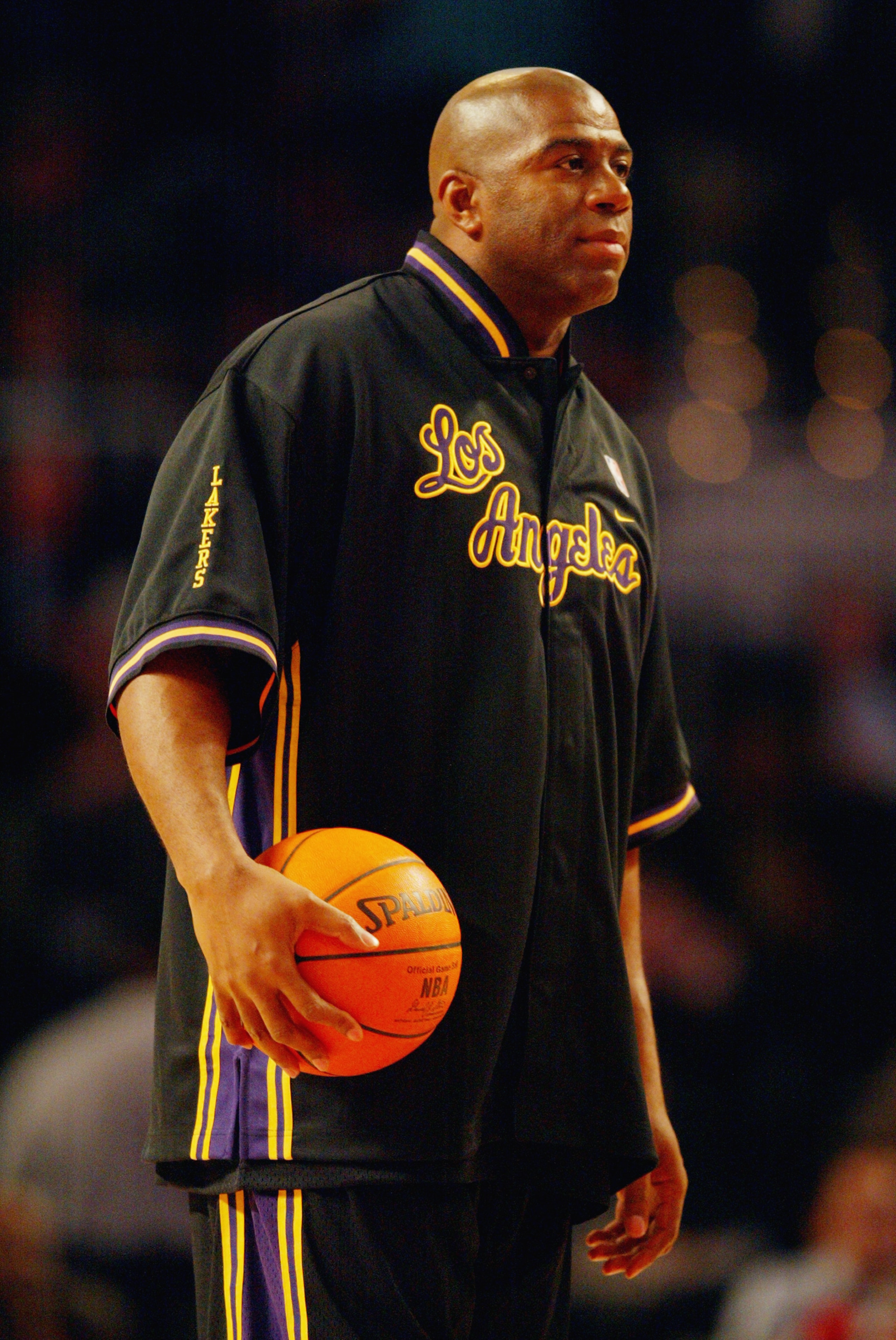ATLANTA - FEBRUARY 8:  Ervin 'Magic' Johnson of the Los Angeles Team looks on before the Jeep Hoop it Up Game during the 2003 NBA All Star weekend at Philips Arena on February 8, 2003 in Atlanta, Georgia.  NOTE TO USER: User expressly acknowledges and agr