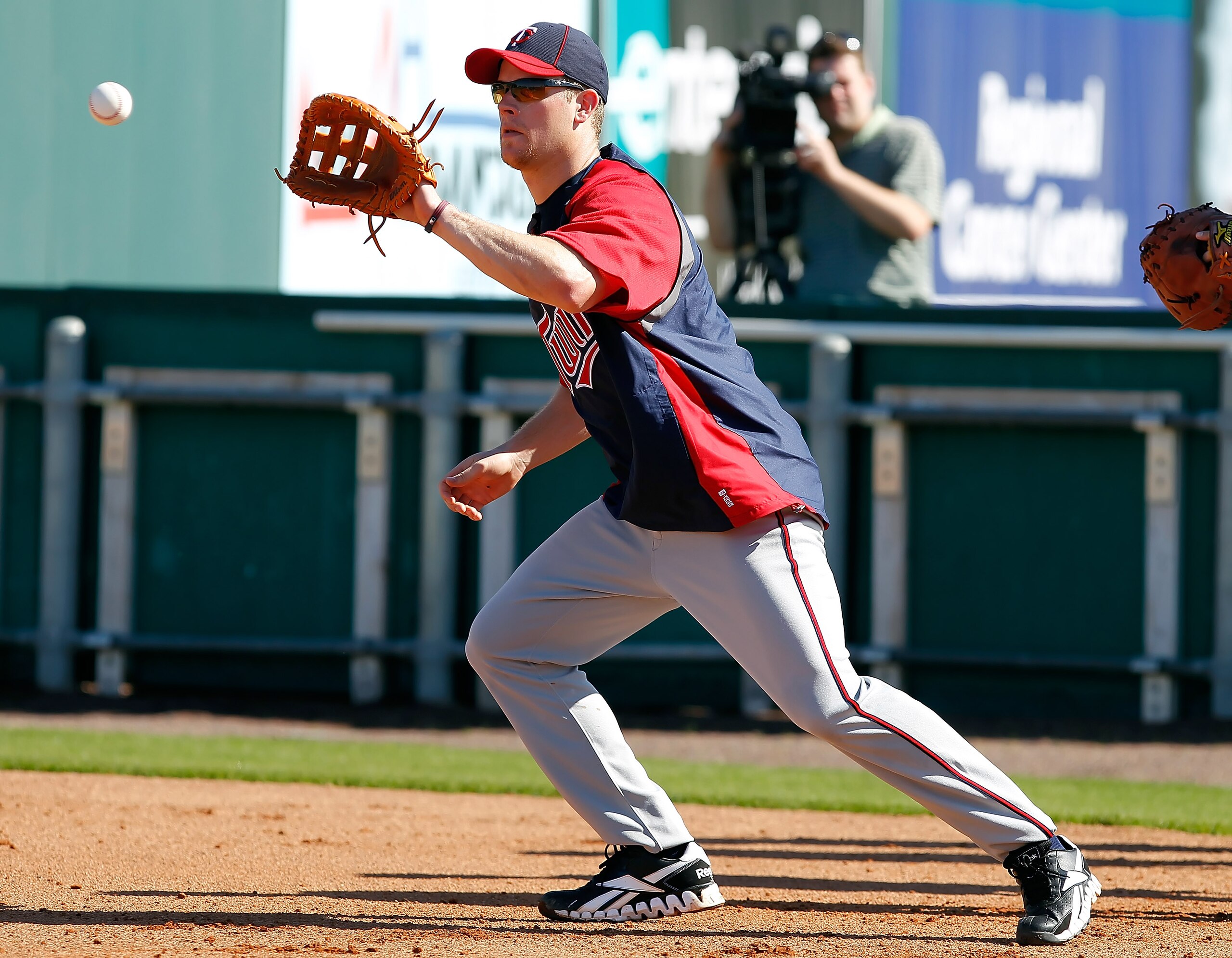 FORT MYERS, FL - FEBRUARY 23:  Infielder Justin Morneau #33 of the Minnesota Twins fields some balls during a spring training workout session at Hammond Stadium on February 23, 2011 in Fort Myers, Florida.  (Photo by J. Meric/Getty Images)