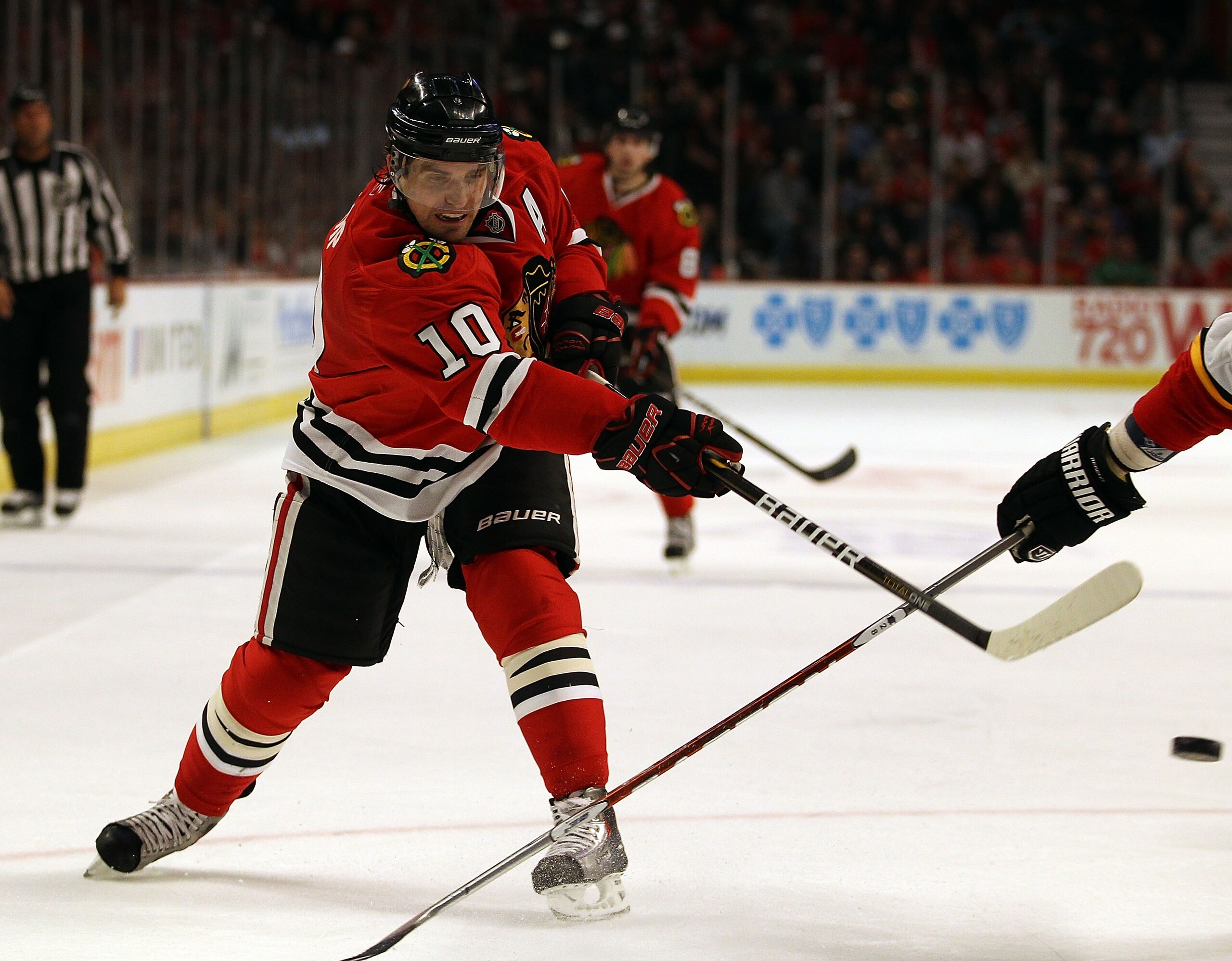 CHICAGO, IL - MARCH 02: Patrick Sharp of the Chicago Blackhawks shoots the puck against the Calgary Flames at the United Center on March 2, 2011 in Chicago, Illinois. The Blackhawks defeated the Flames 5-2. (Photo by Jonathan Daniel/Getty Images)