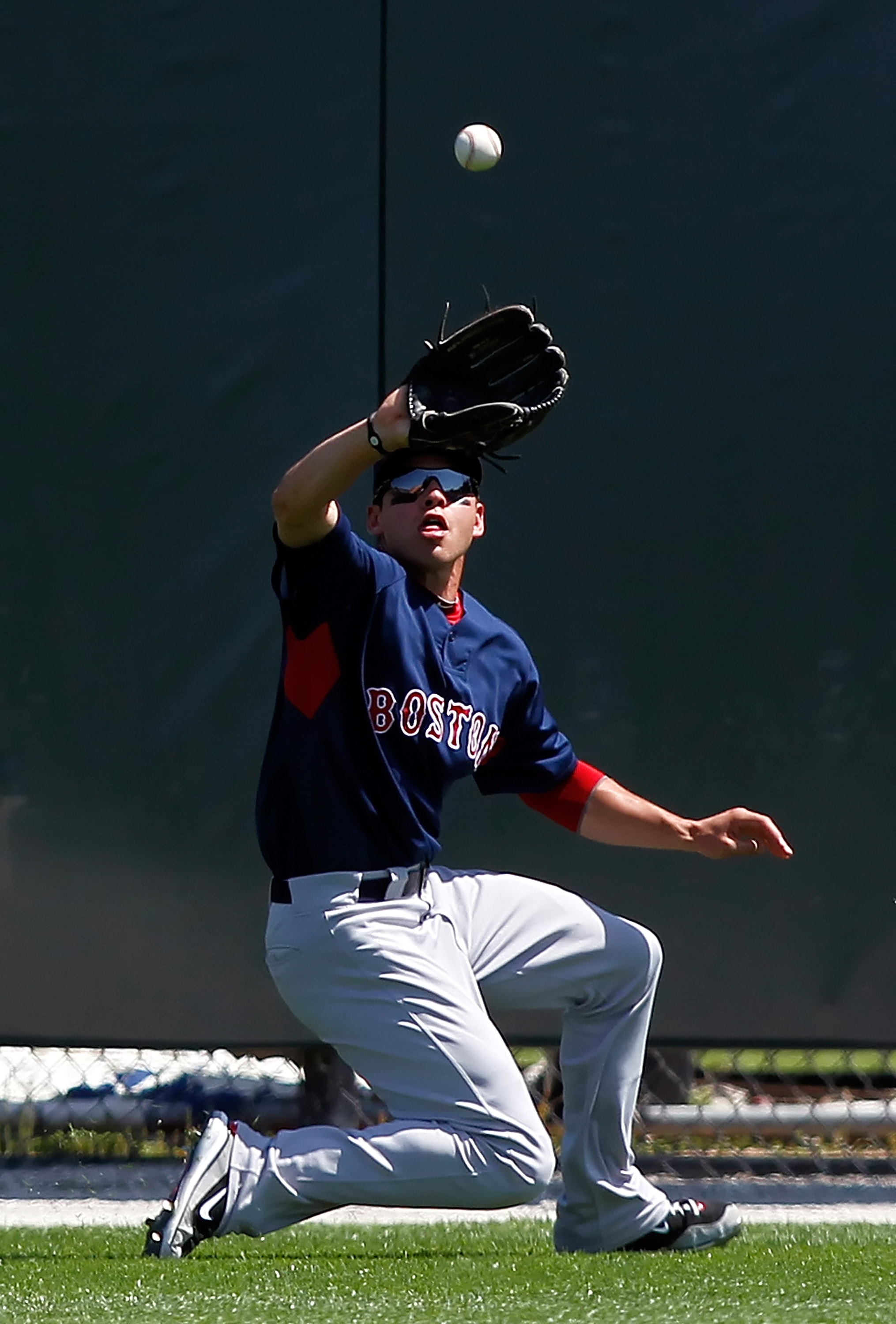 SARASOTA, FL - MARCH 27:  Outfielder Jacoby Ellsbury #2 of the Boston Red Sox  catches a fly ball against the Baltimore Orioles during a Grapefruit League Spring Training Game at Ed Smith Stadium on March 27, 2010 in Sarasota, Florida.  (Photo by J. Meric