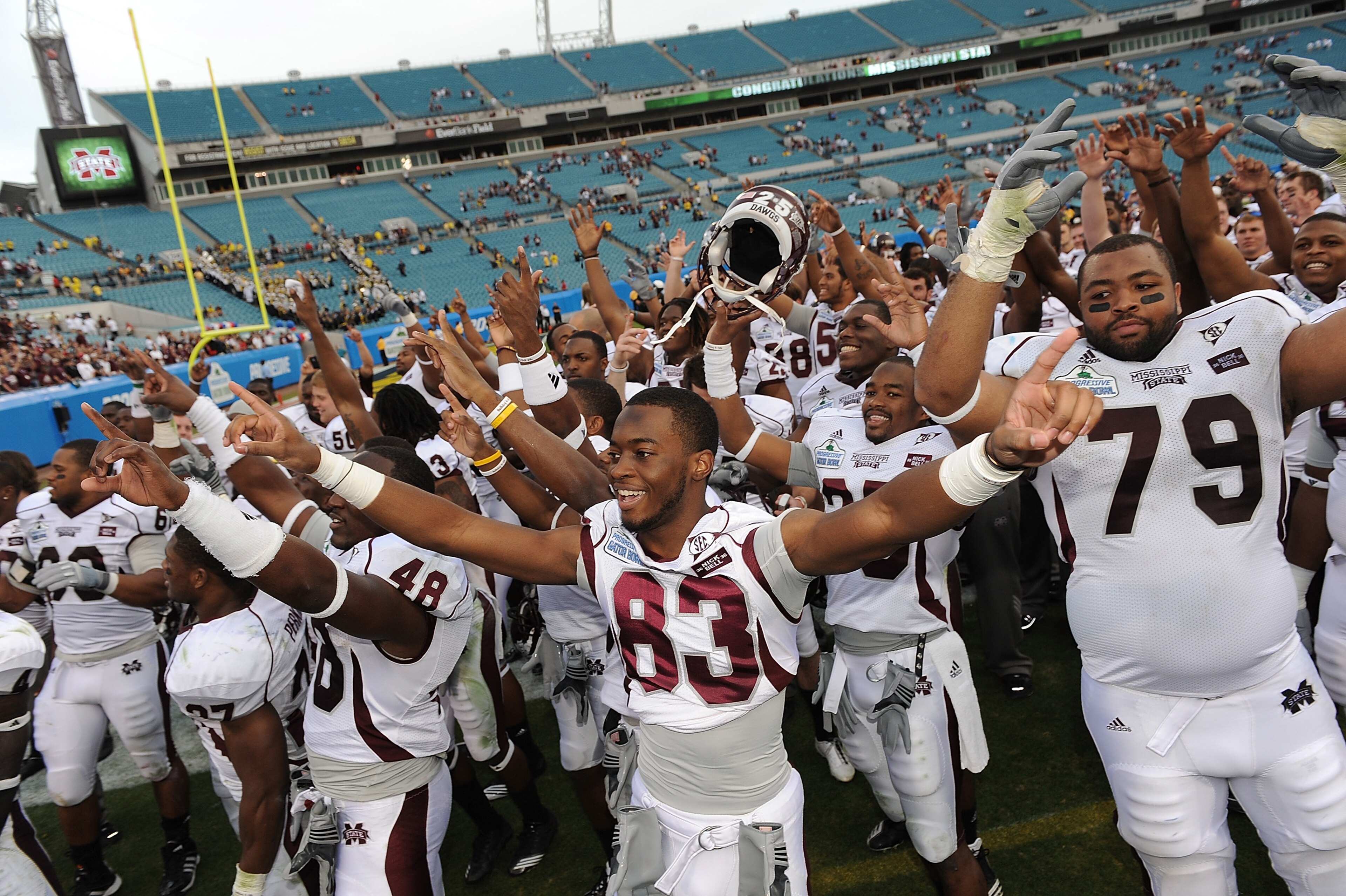 JACKSONVILLE, FL - JANUARY 01: The Mississippi Bulldogs players celebrate following their victory over the Michigan Wolverines at the Gator Bowl at EverBank Field on January 1, 2011 in Jacksonville, Florida (Photo by Rick Dole/Getty Images) JACKSONVILLE, FL - JANUARY 01: The Mississippi Bulldogs players celebrate following their victory over the Michigan Wolverines at the Gator Bowl at EverBank Field on January 1, 2011 in Jacksonville, Florida (Photo by Rick Dole/Getty Images)