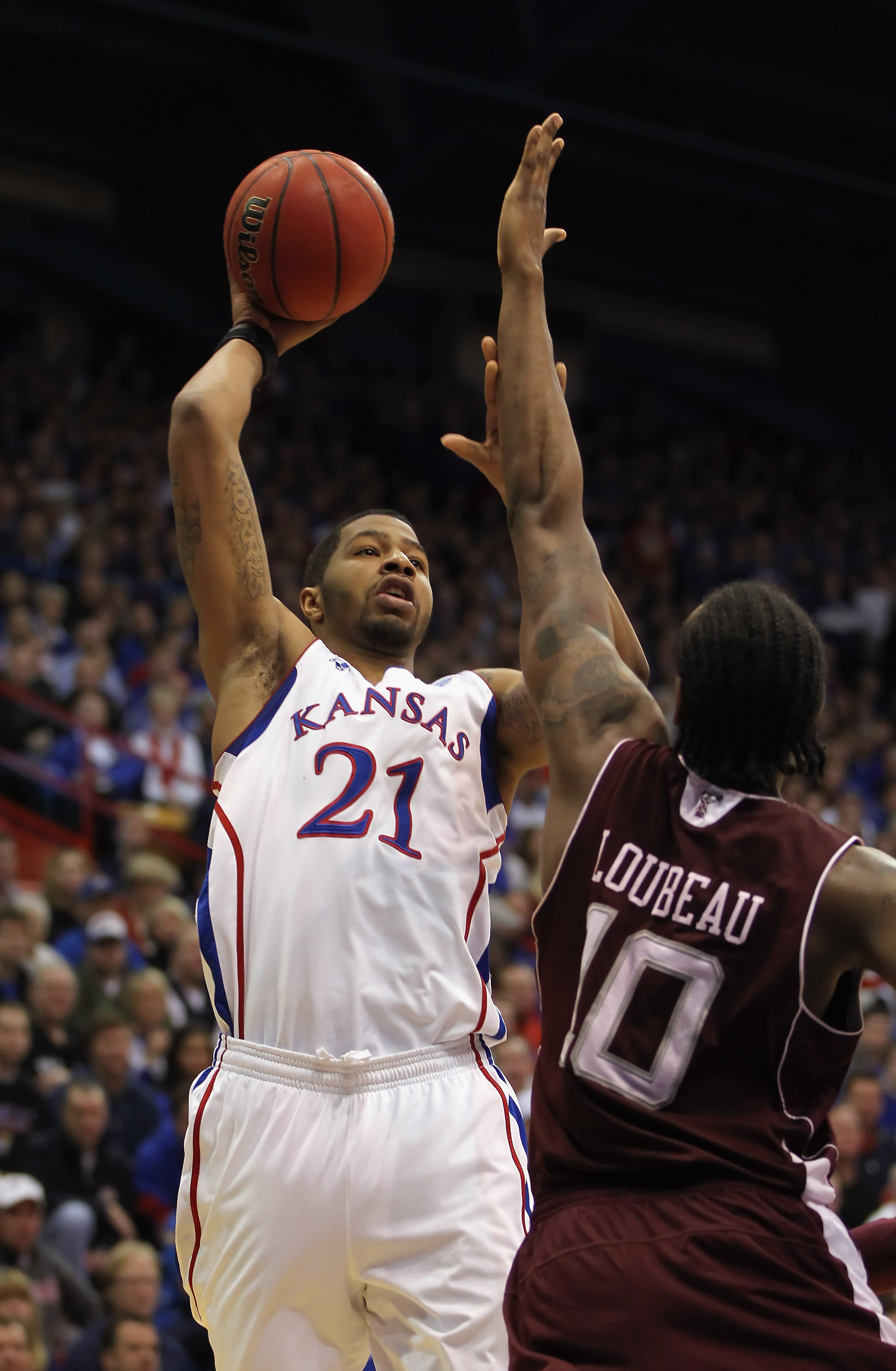 LAWRENCE, KS - MARCH 02: Markieff Morris #21 of the Kansas Jayhawks shoots over David Loubeau #10 of the Texas A&M Aggies during the game on March 2, 2011 at Allen Fieldhouse in Lawrence, Kansas. (Photo by Jamie Squire/Getty Images) LAWRENCE, KS - MARCH 02: Markieff Morris #21 of the Kansas Jayhawks shoots over David Loubeau #10 of the Texas A&M Aggies during the game on March 2, 2011 at Allen Fieldhouse in Lawrence, Kansas. (Photo by Jamie Squire/Getty Images)