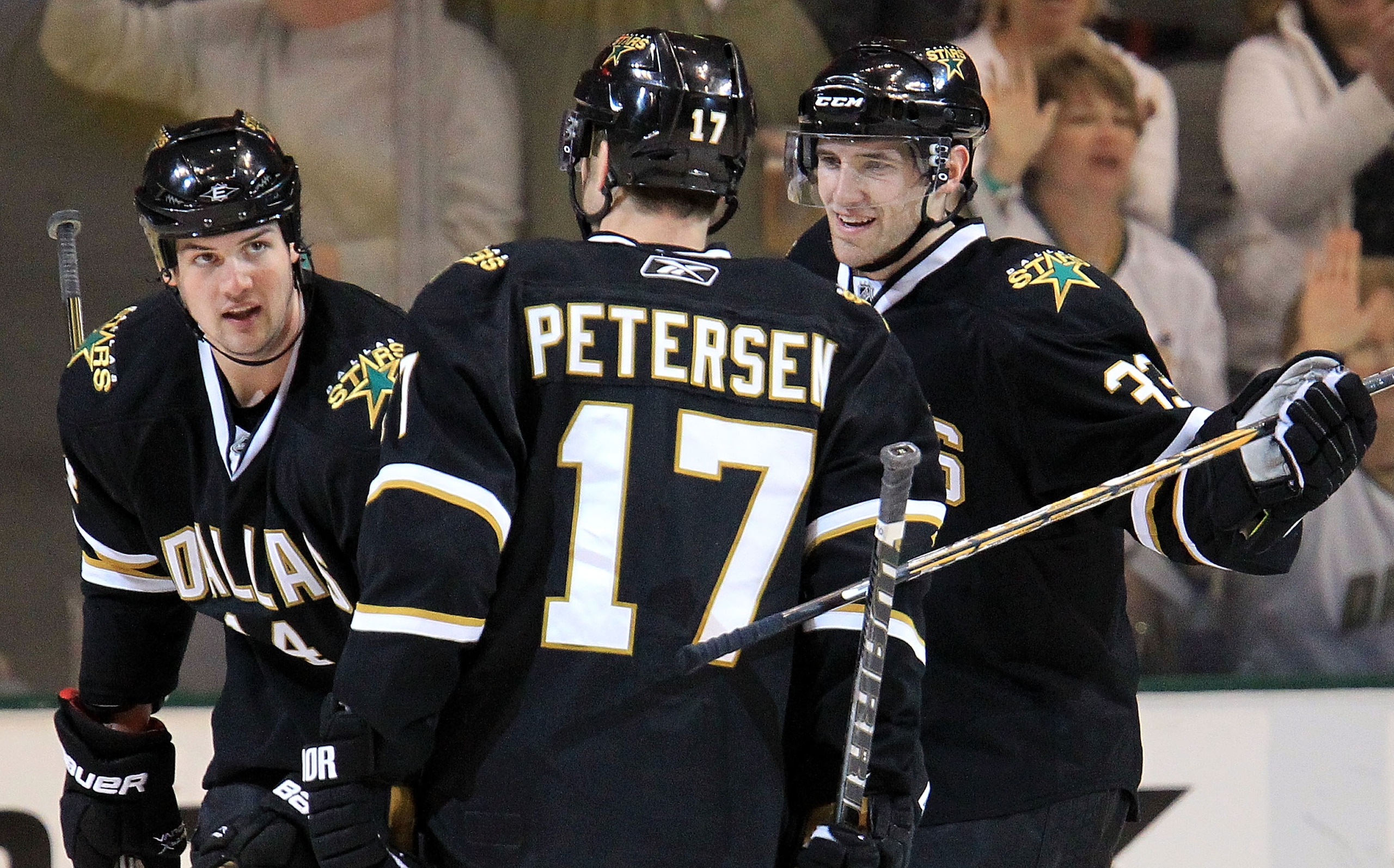 DALLAS, TX - MARCH 15:  Center Toby Petersen #17 of the Dallas Stars celebrates a goal with Jamie Benn #14 and Alex Goligoski #33 against the San Jose Sharks at American Airlines Center on March 15, 2011 in Dallas, Texas.  (Photo by Ronald Martinez/Getty