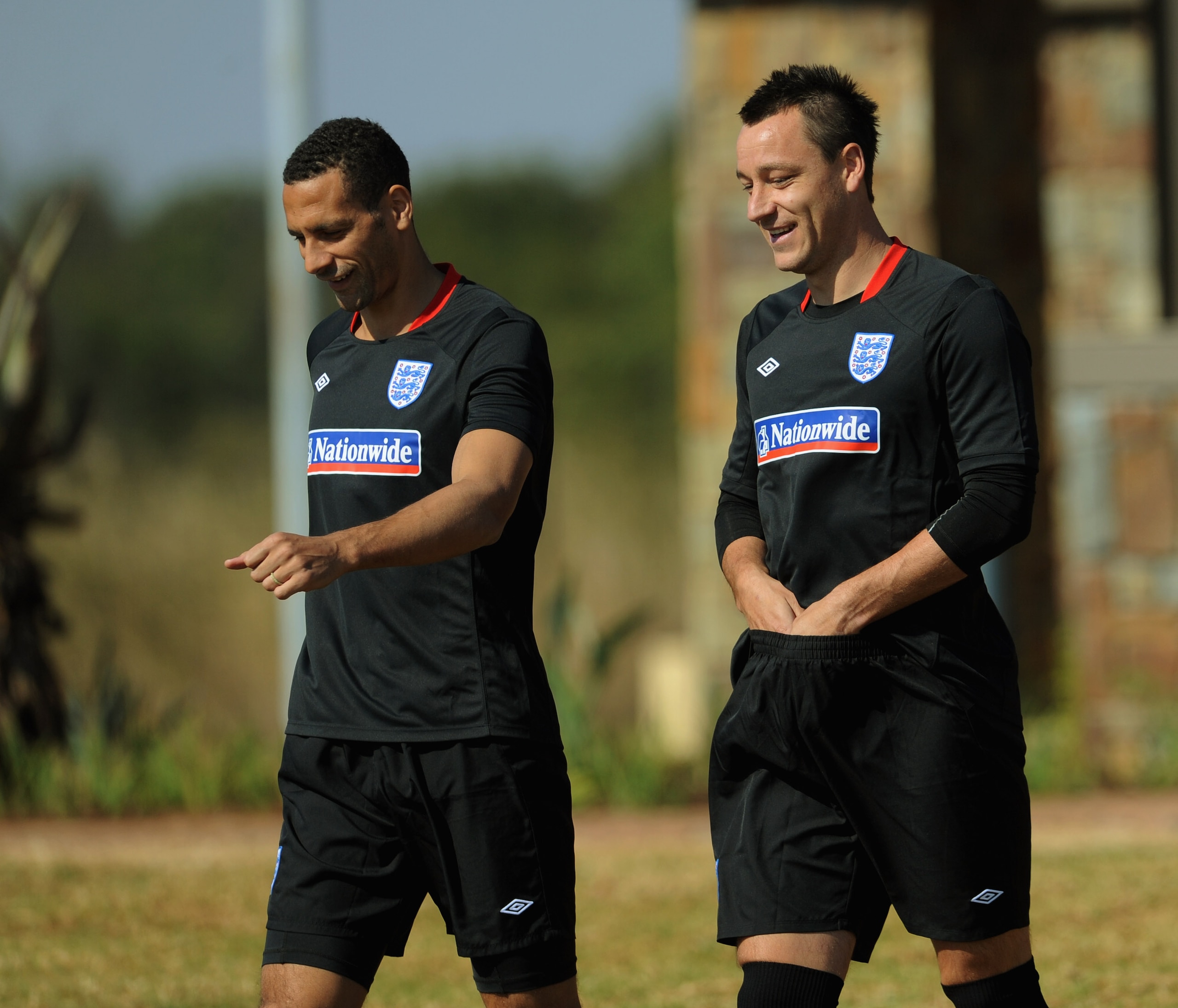 RUSTENBURG, SOUTH AFRICA - JUNE 04: Rio Ferdinand and John Terry share a joke during the England training session at the Royal Bafokeng Sports Campus on June 4, 2010 in Rustenburg, South Africa.  (Photo by Michael Regan/Getty Images)