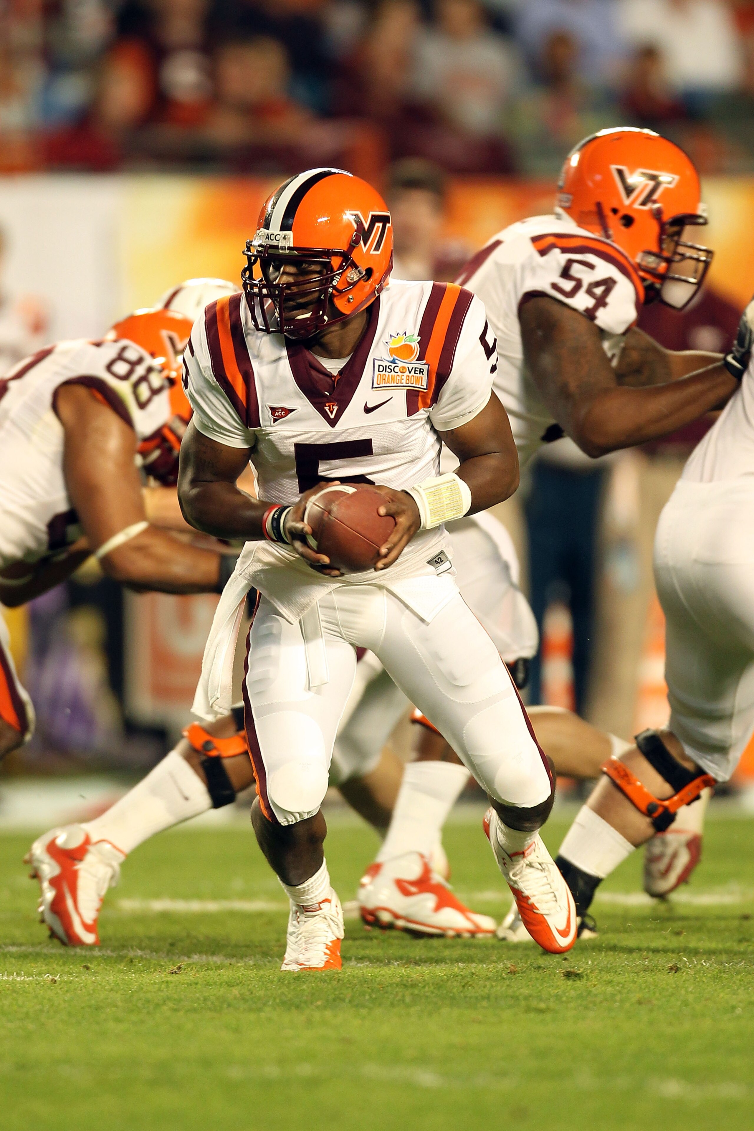 MIAMI, FL - JANUARY 03:  Tyrod Taylor #5 of the Virginia Tech Hokies turns to hand the ball off against the Stanford Cardinal during the 2011 Discover Orange Bowl at Sun Life Stadium on January 3, 2011 in Miami, Florida. Stanford won 40-12.  (Photo by Mik