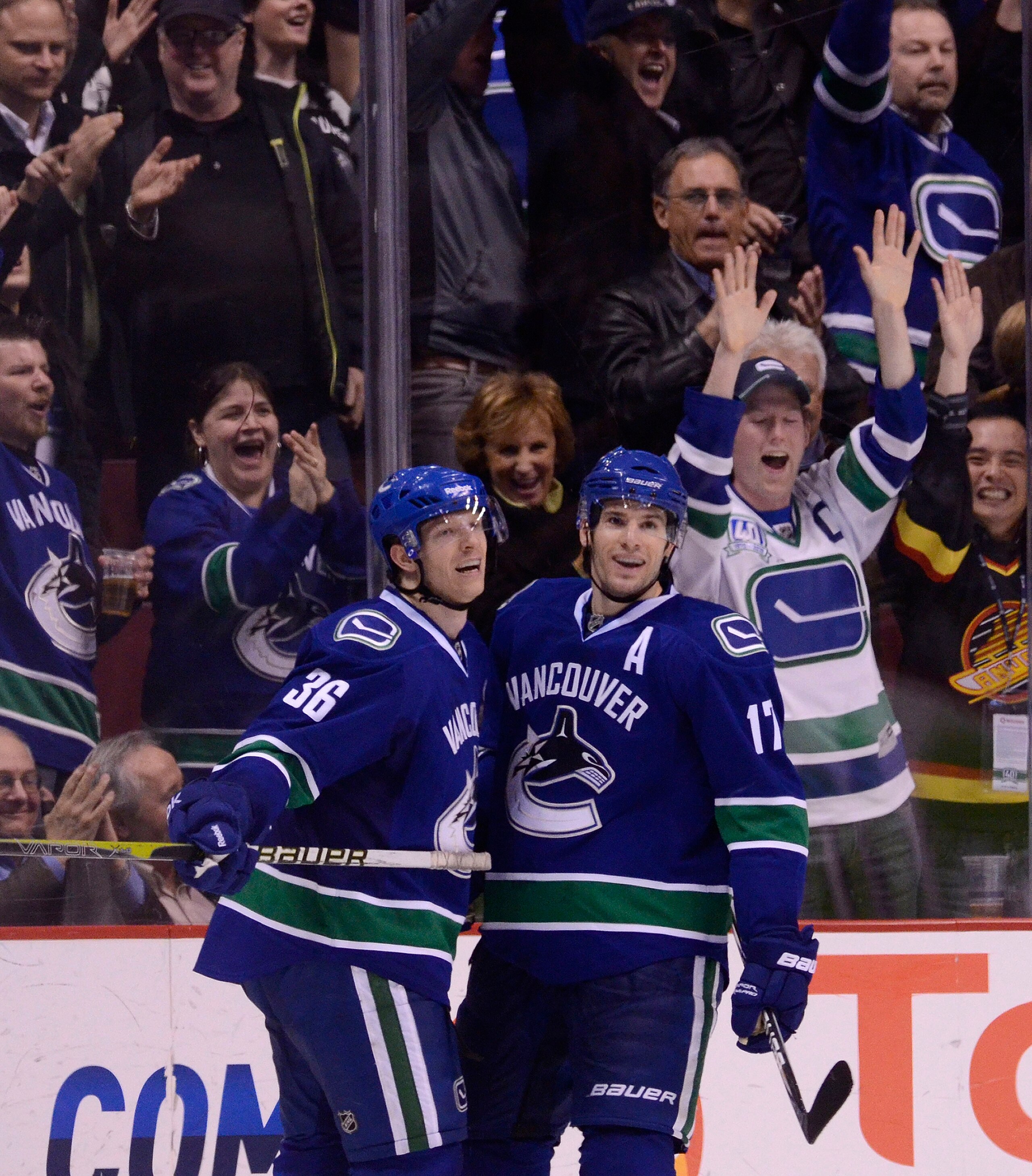 VANCOUVER, CANADA - MARCH 14: Ryan Kesler #17 of the Vancouver Canucks celebrates with Jannik Hansen #36 after scoring his second goal of the night against the Minnesota Wild during the third period in NHL action on March 14, 2011 at Rogers Arena in Vanco