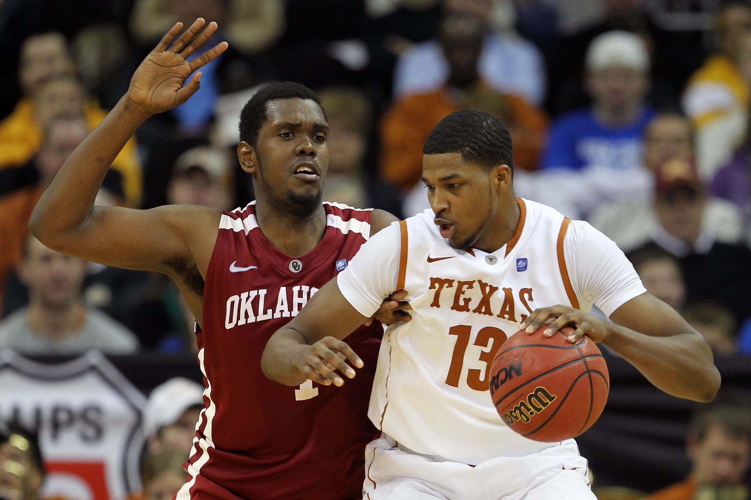 KANSAS CITY, MO - MARCH 10:  Tristan Thompson #13 of the Texas Longhorns drives with the ball against Andrew Fitzgerald #4 of the Oklahoma Sooners during their quarterfinal game in the 2011 Phillips 66 Big 12 Men's Basketball Tournament at Sprint Center o