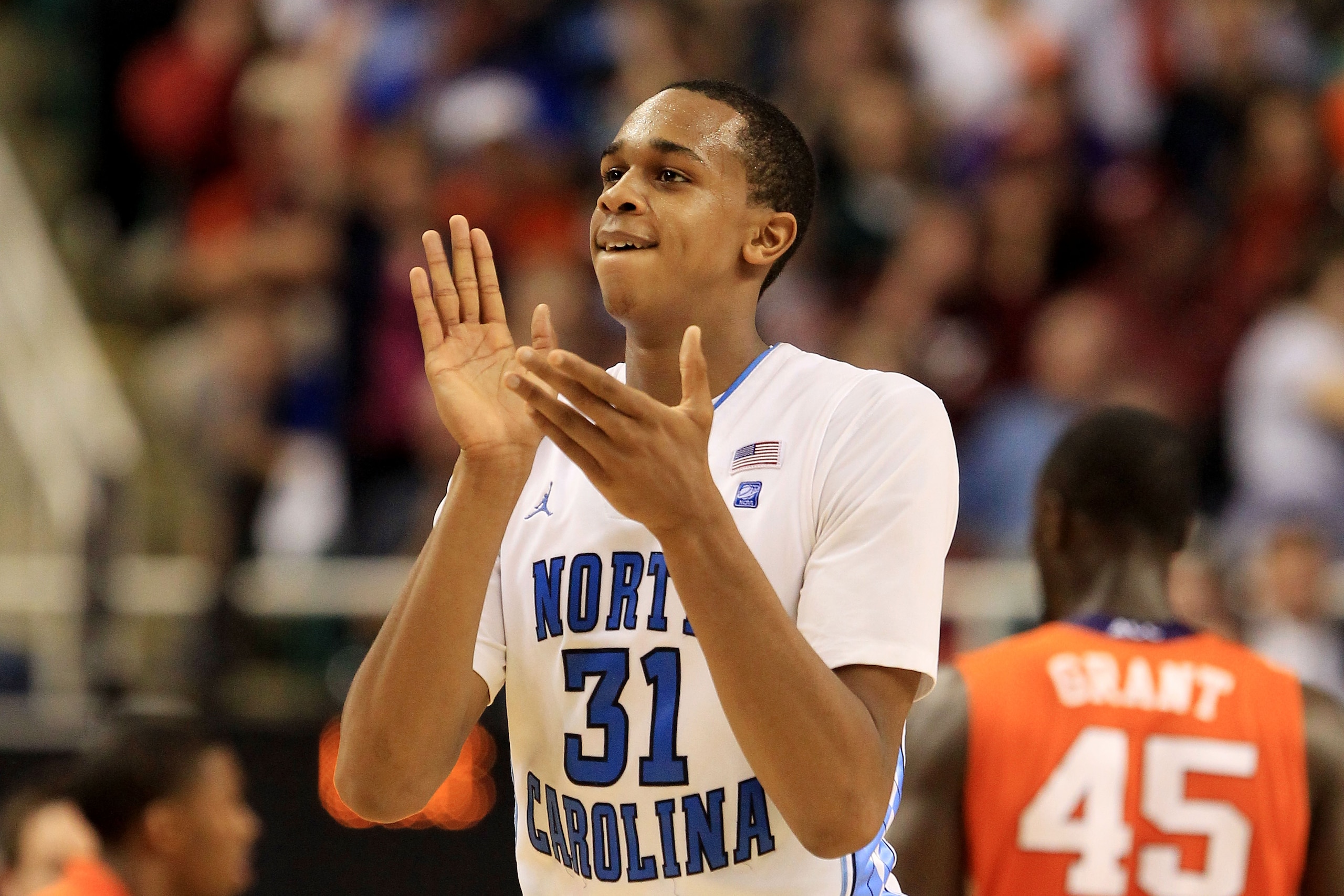GREENSBORO, NC - MARCH 12:  John Henson #31 of the North Carolina Tar Heels claps during overtime against the Clemson Tigers in the semifinals of the 2011 ACC men's basketball tournament at the Greensboro Coliseum on March 12, 2011 in Greensboro, North Ca