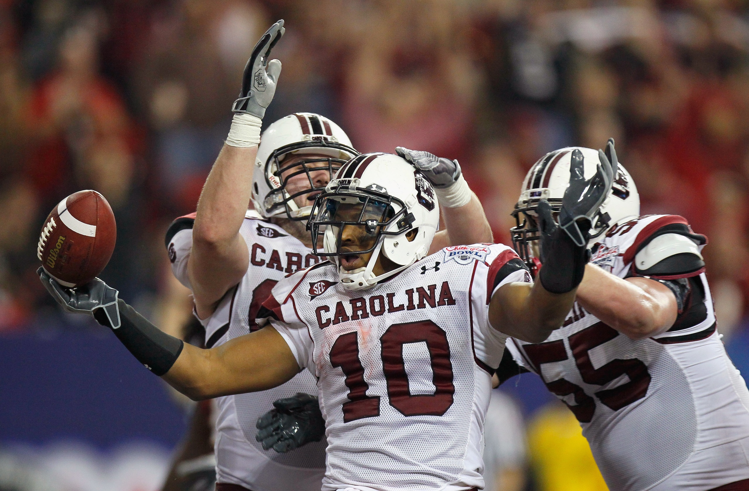 ATLANTA, GA - DECEMBER 31:  Brian Maddox #10 of the South Carolina Gamecocks reacts after scoring a touchdown against the Florida State Seminoles with Hutch Eckerson #66 and T.J. Johnson #55 during the 2010 Chick-fil-A Bowl at Georgia Dome on December 31,