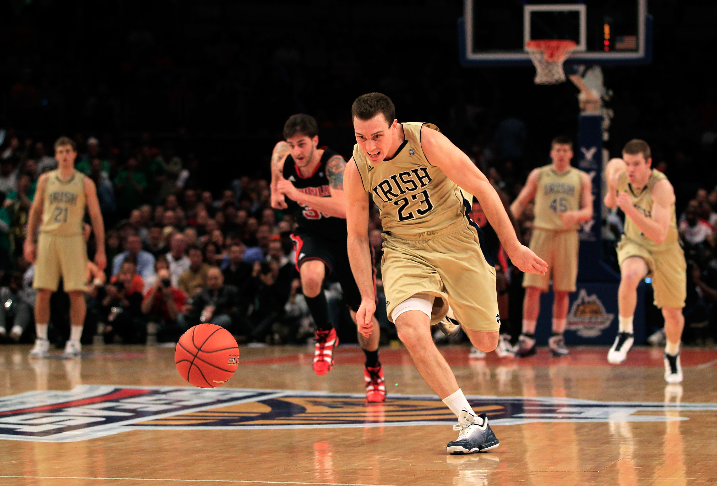NEW YORK, NY - MARCH 11: Ben Hansbrough #23 of the Notre Dame Fighting Irish runs down a loose ball against the Louisville Cardinals during the semifinals of the 2011 Big East Men's Basketball Tournament presented by American Eagle Outfitters at Madison S