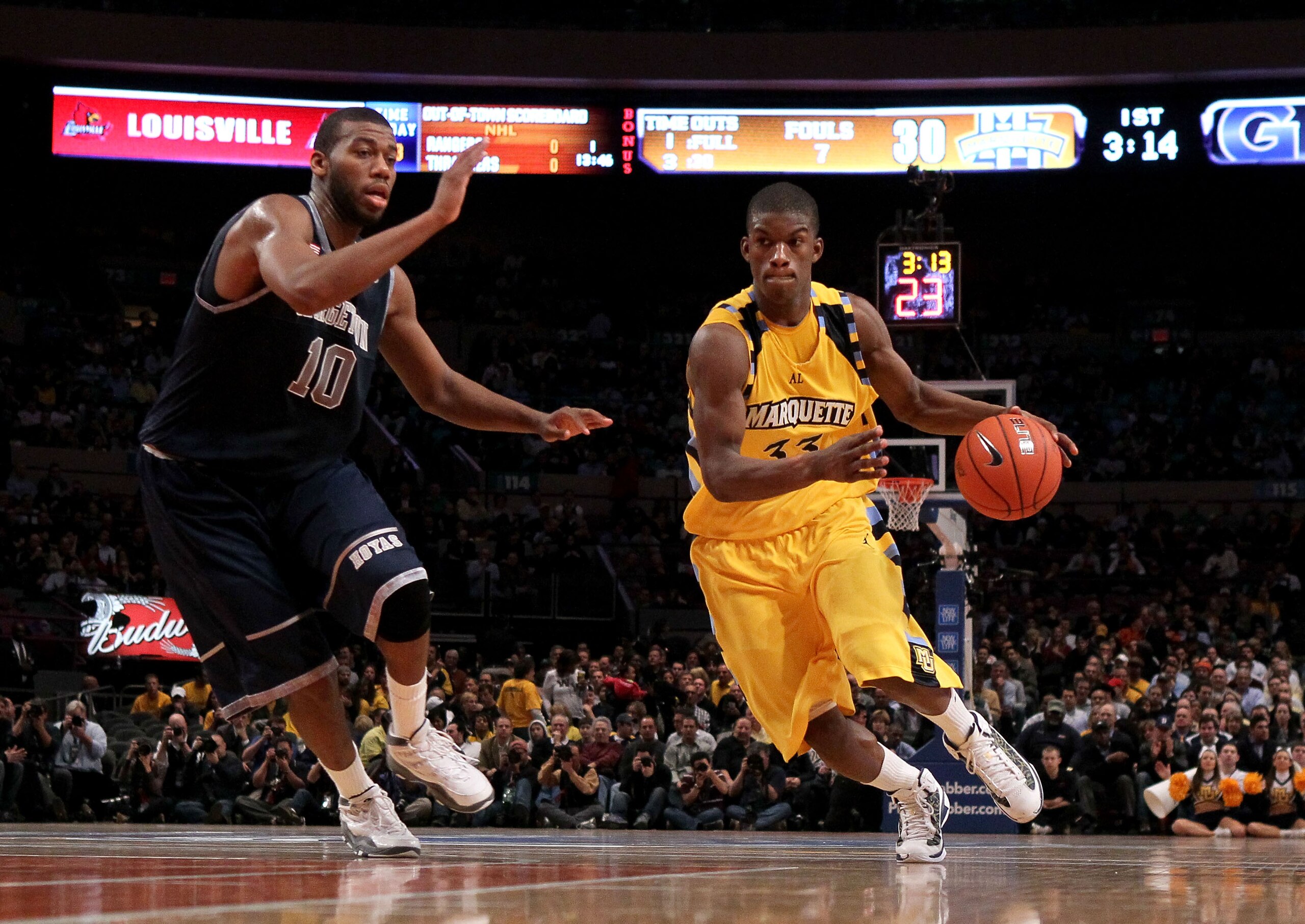 NEW YORK - MARCH 12:  Jimmy Butler #33 of the Marquette Golden Eagles handles the ball against Greg Monroe #10 of the Georgetown Hoyas during the semifinal of the 2010 Big East Tournament at Madison Square Garden on March 12, 2010 in New York City.  (Phot