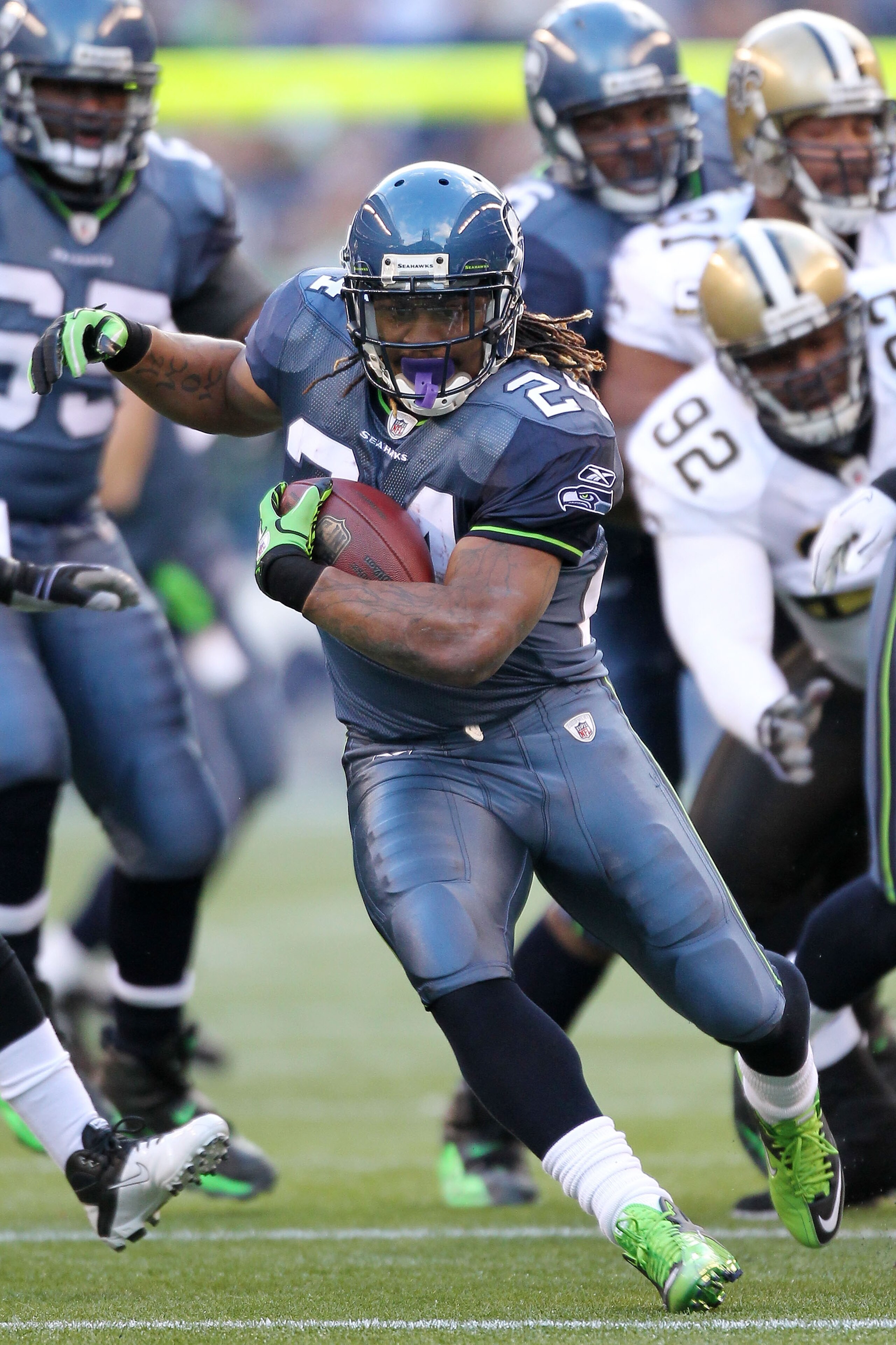 SEATTLE, WA - JANUARY 08:  Marshawn Lynch #24 of the Seattle Seahawks runs down field against the New Orleans Saints during the 2011 NFC wild-card playoff game at Qwest Field on January 8, 2011 in Seattle, Washington.  (Photo by Otto Greule Jr/Getty Image