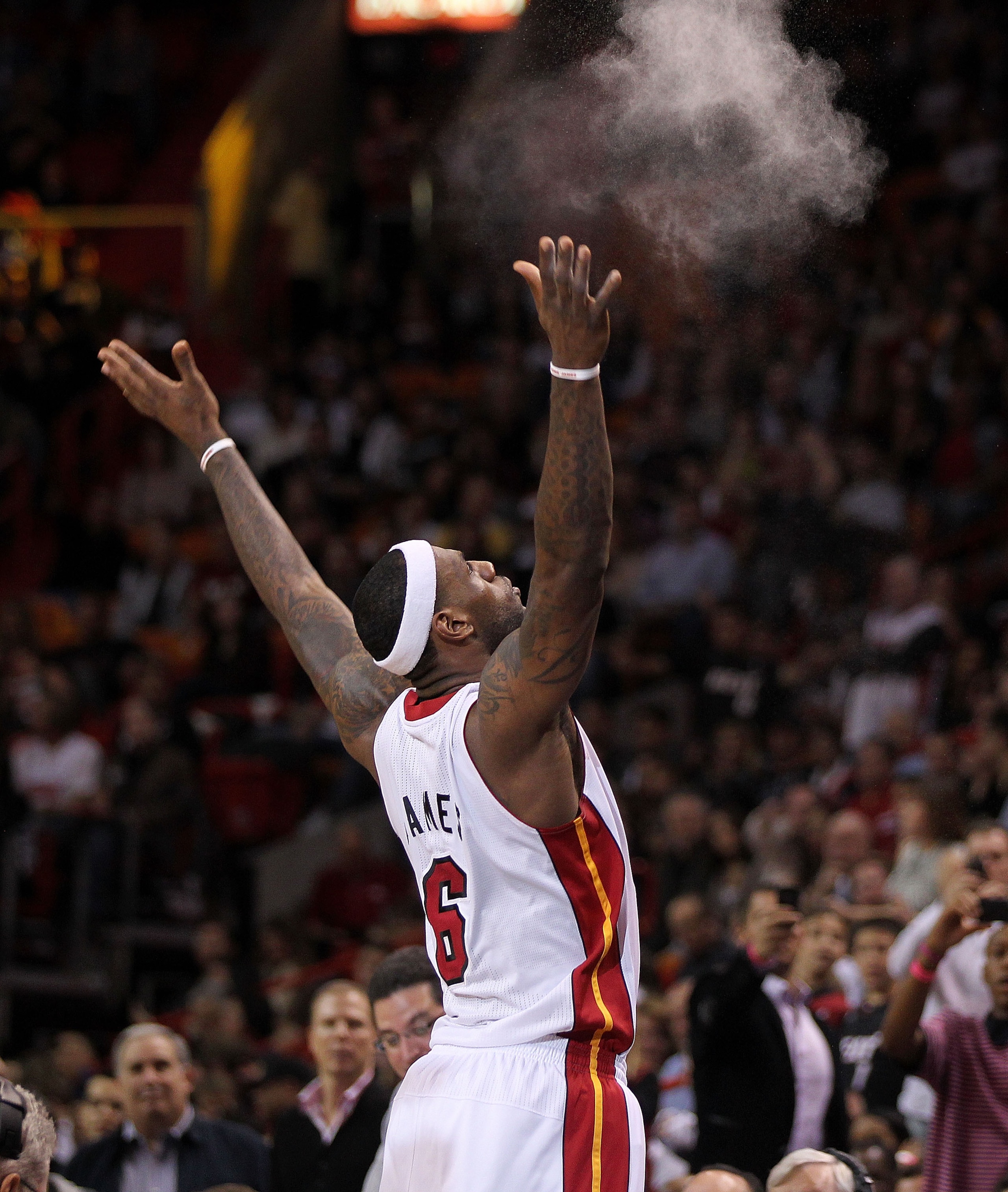 MIAMI, FL - JANUARY 22:  LeBron James #6 of the Miami Heat throws chalk in the air during a game against the Toronto Raptors at American Airlines Arena on January 22, 2011 in Miami, Florida. NOTE TO USER: User expressly acknowledges and agrees that, by do