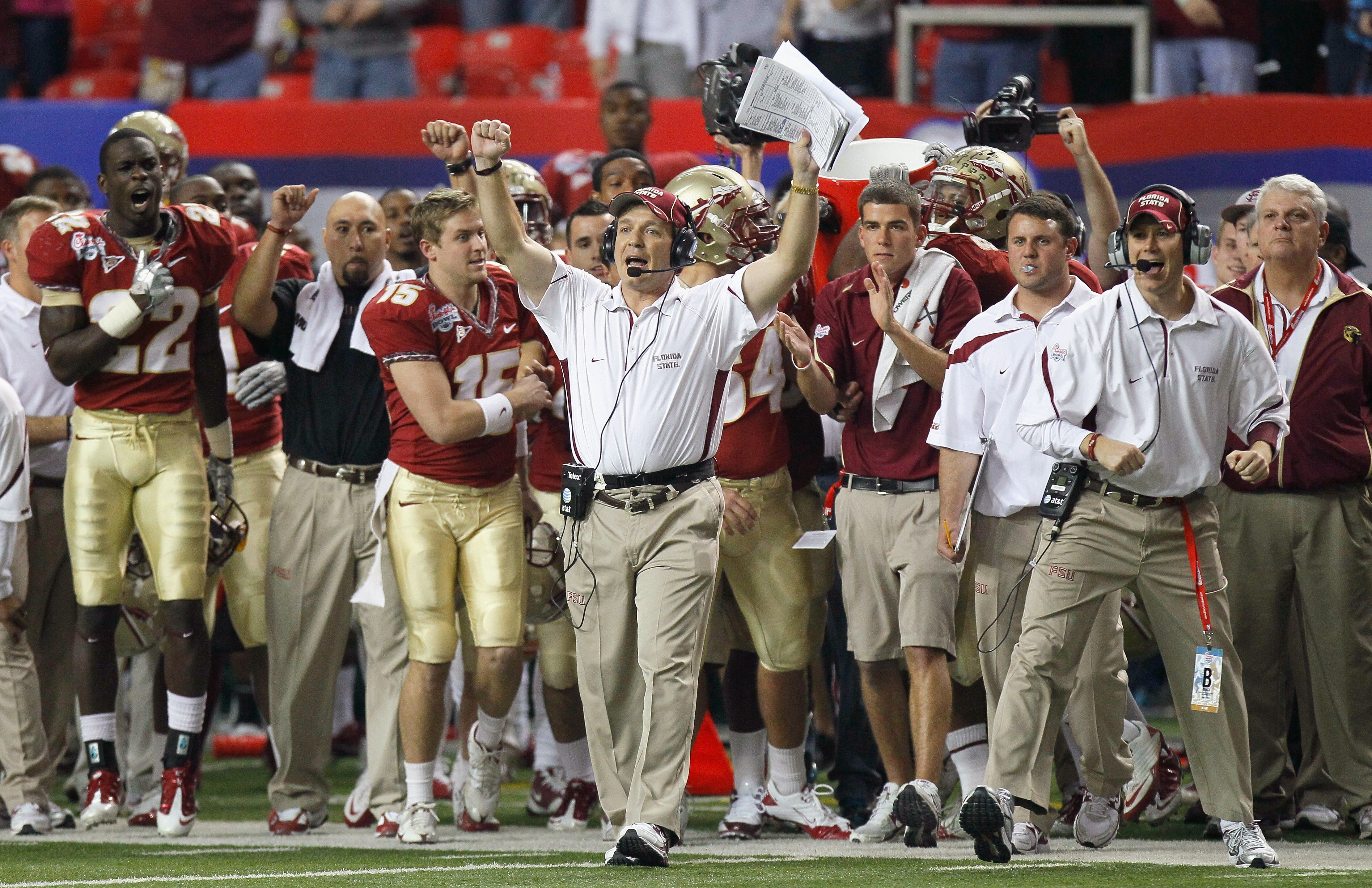 ATLANTA, GA - DECEMBER 31:  Head coach Jimbo Fisher and the Florida State Seminoles sideline reacts after getting a first down in the final seconds of their 26-17 win over the South Carolina Gamecocks during the 2010 Chick-fil-A Bowl at Georgia Dome on De