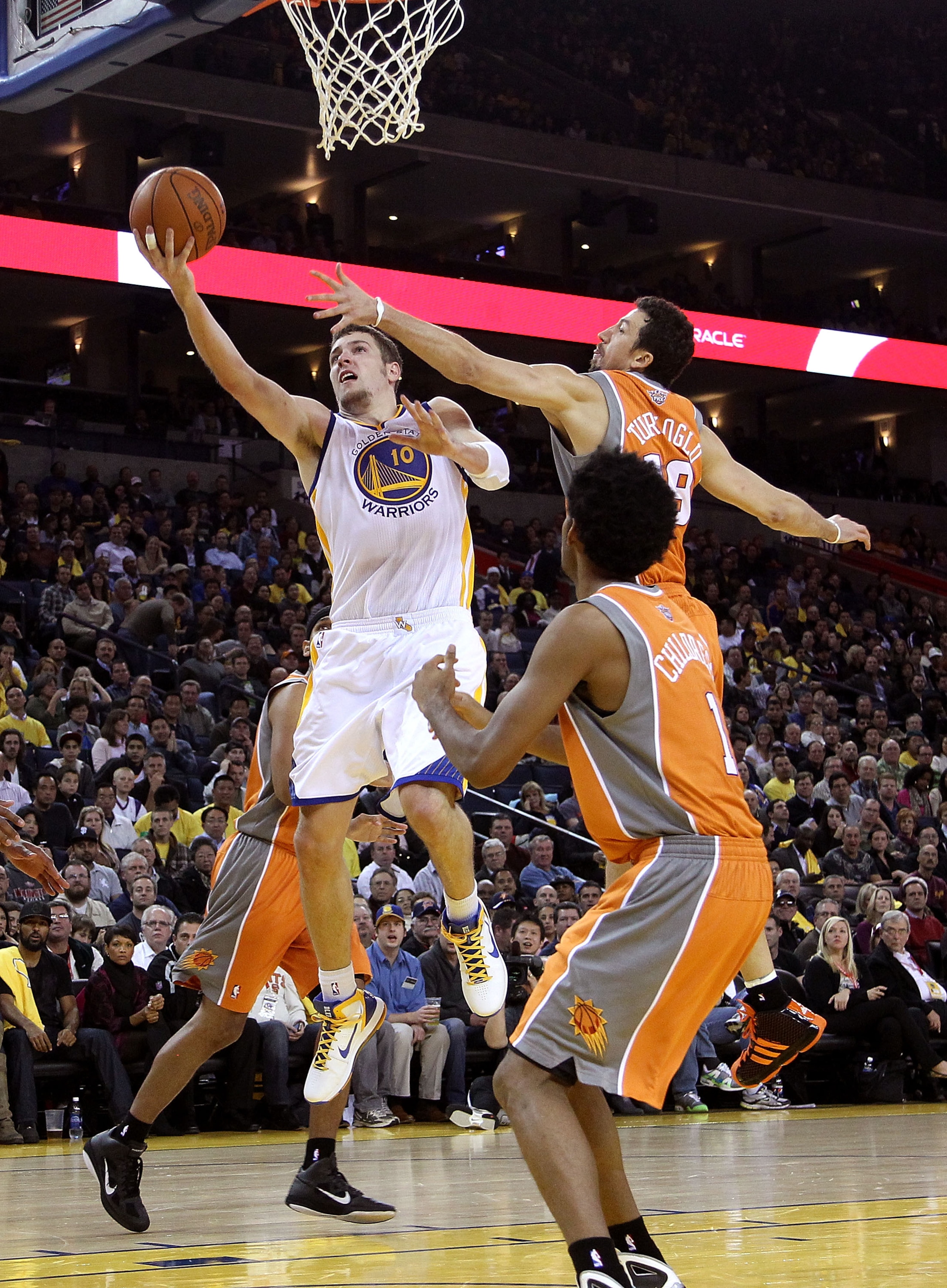 OAKLAND, CA - DECEMBER 02: David Lee #10 of the Golden State Warriors drives to the basket against the Phoenix Suns at Oracle Arena on December 2, 2010 in Oakland, California. NOTE TO USER: User expressly acknowledges and agrees that, by downloading and OAKLAND, CA - DECEMBER 02: David Lee #10 of the Golden State Warriors drives to the basket against the Phoenix Suns at Oracle Arena on December 2, 2010 in Oakland, California. NOTE TO USER: User expressly acknowledges and agrees that, by downloading and
