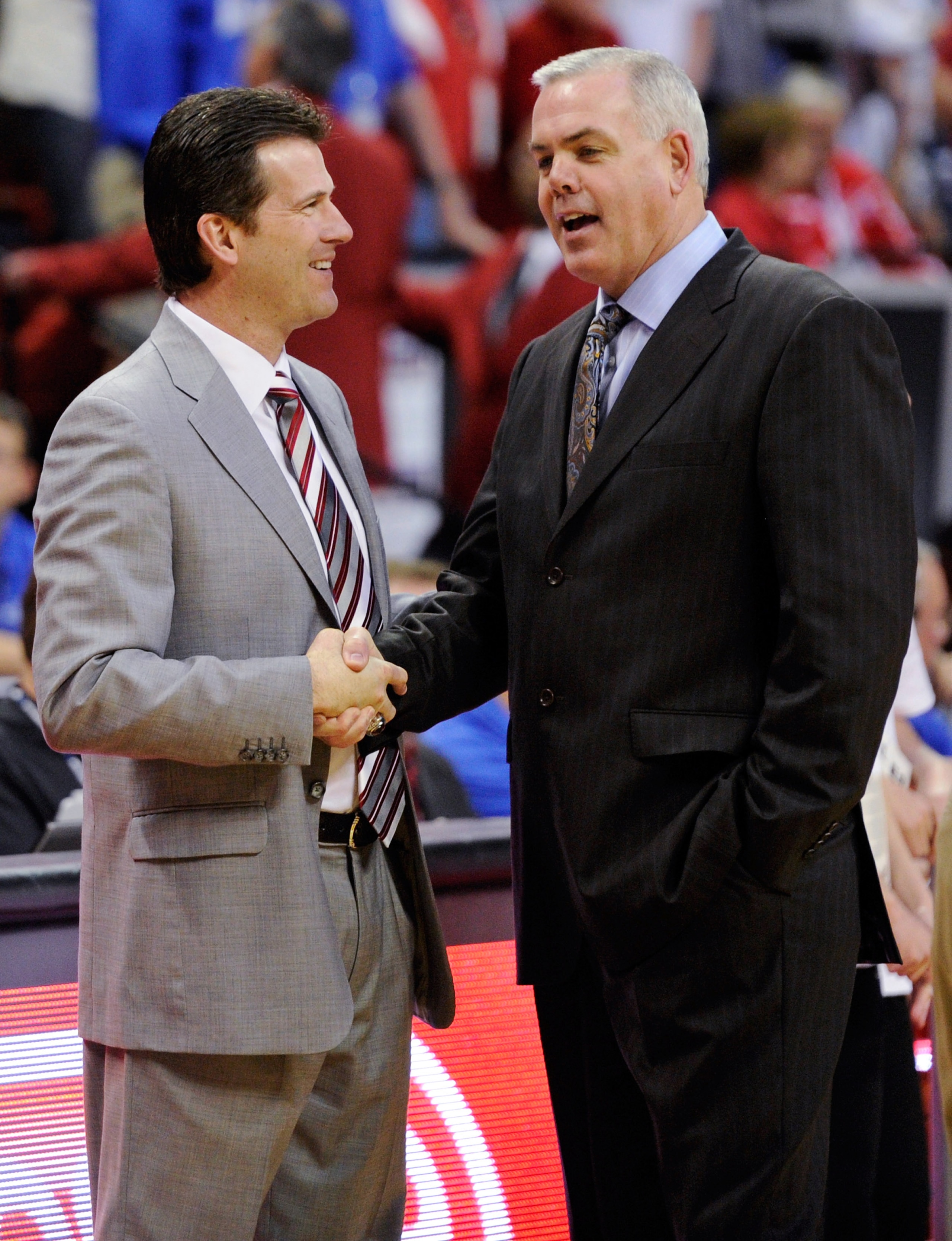 LAS VEGAS, NV - MARCH 11:  Head coach Steve Alford (L) of the New Mexico Lobos and head coach Dave Rose of the Brigham Young University Cougars greet each other before their semifinal game of the Conoco Mountain West Conference Basketball tournament at th