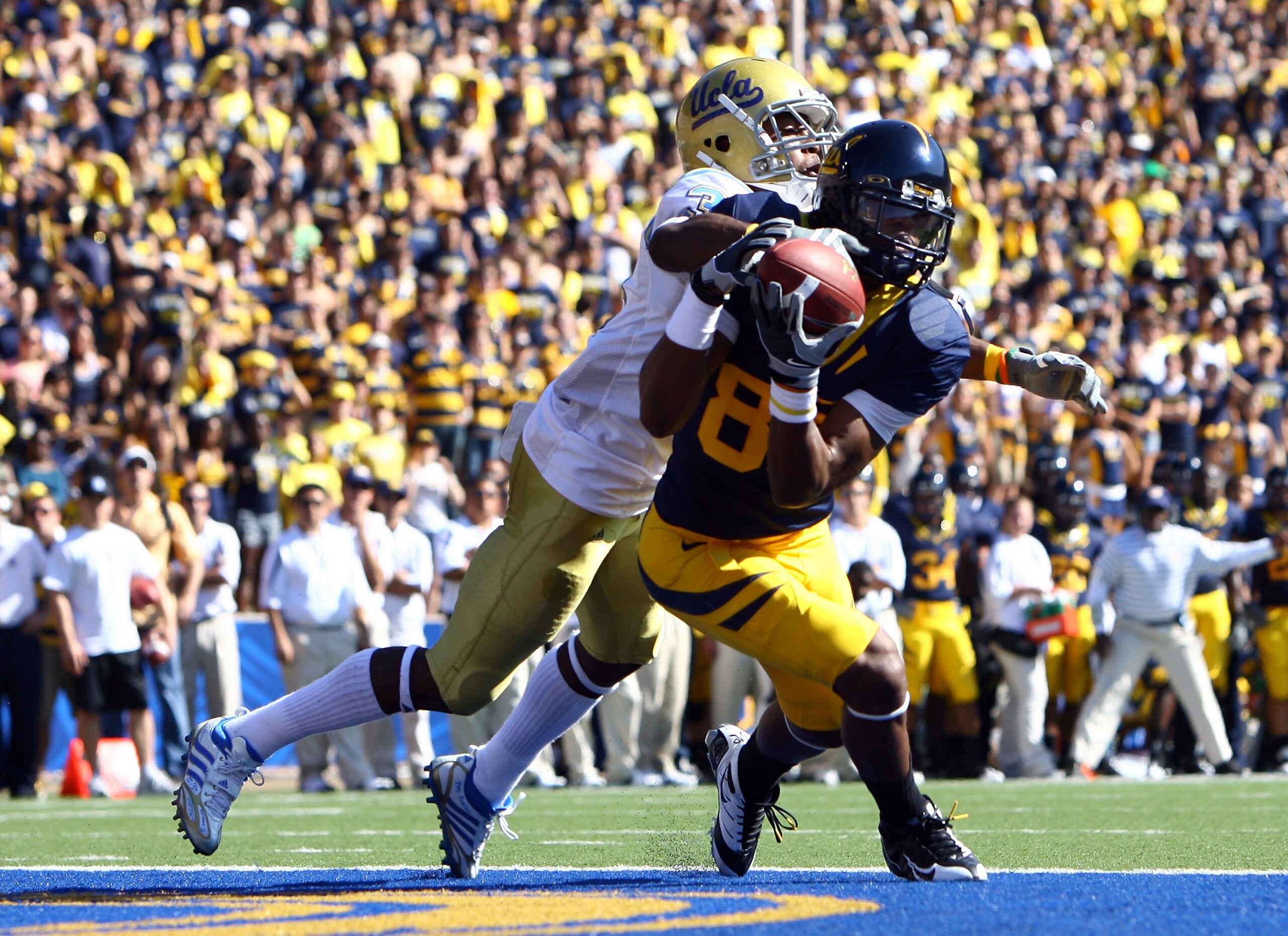 BERKELEY, CA - OCTOBER 25:  Wide receiver LaReylle Cunningham #85 of the Cal Golden Bears appears to a make a catch but would later drop it while being defended by by Rahim Moore #3 of the UCLA Bruins during the first quarter at Memorial Stadium on Octobe