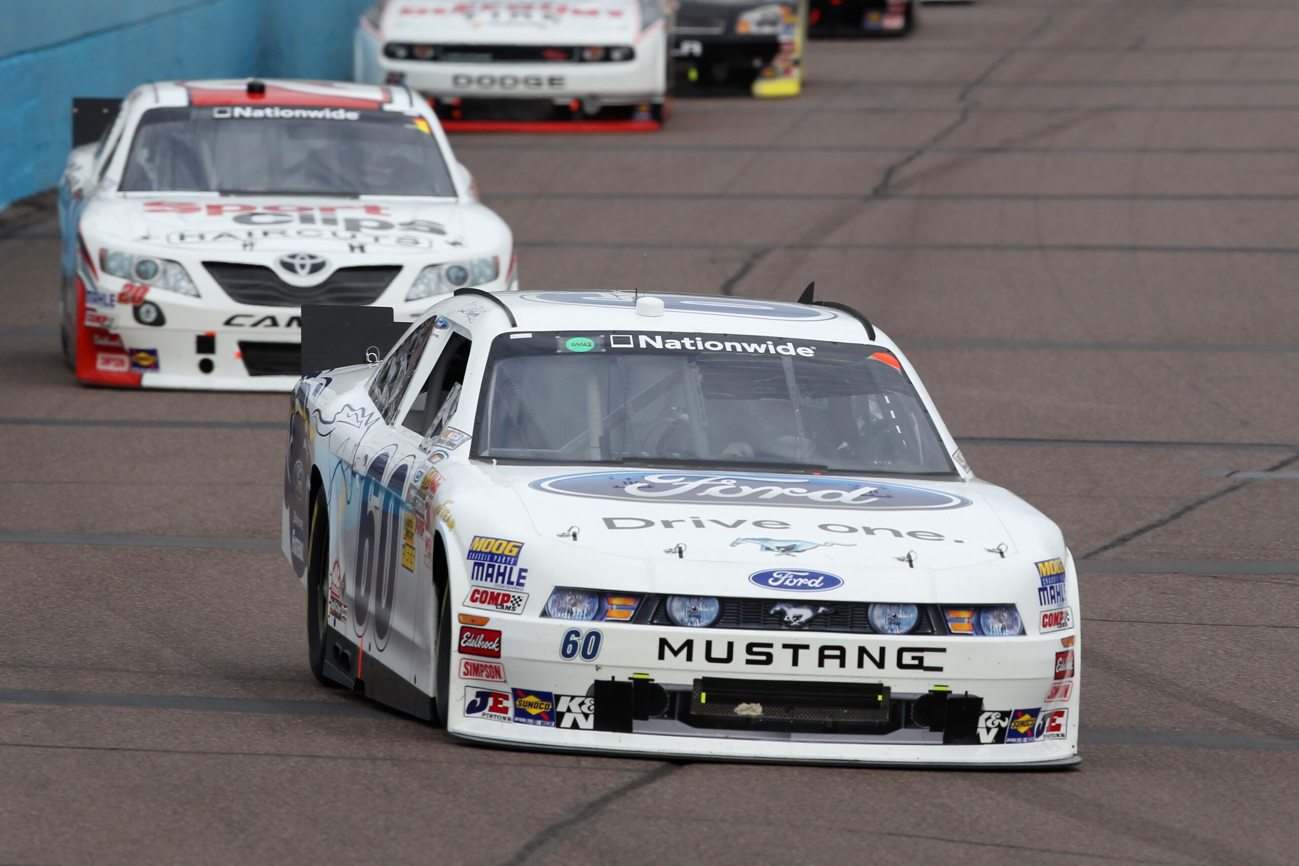 AVONDALE, AZ - FEBRUARY 26:  Carl Edwards, driver of the #60 Ford Drive One Ford, leads a line of cars during the NASCAR Nationwide Series Bashas' Supermarkets 200 at Phoenix International Raceway on February 26, 2011 in Avondale, Arizona.  (Photo by Chri