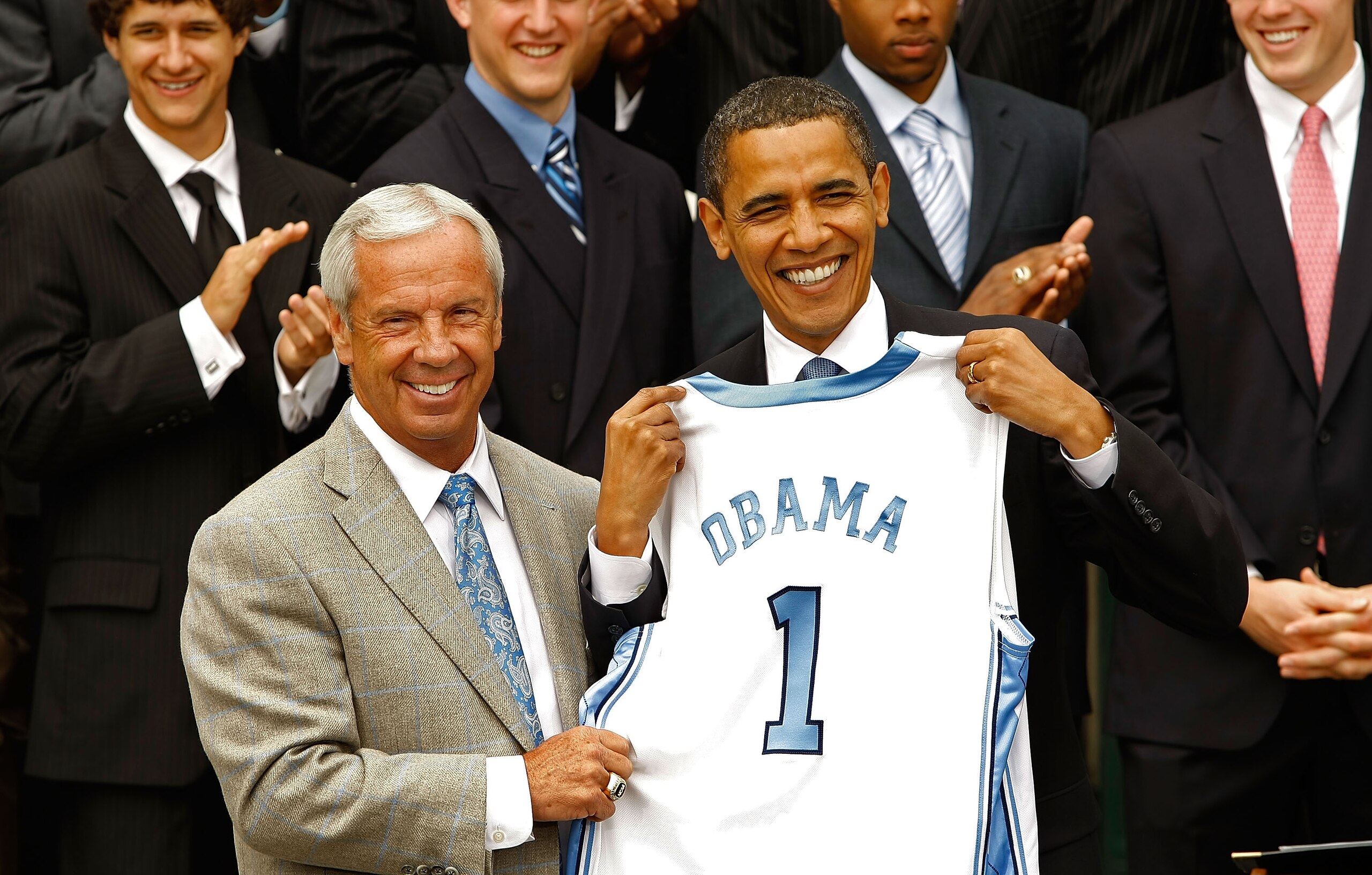 WASHINGTON - MAY 11:  University of North Carolina Men's basketball head coach Roy Williams (L) presents U.S. President Barack Obama with a team jersey at the White House May 11, 2009 in Washington, DC. The North Carolina Tar Heels are the 2009 National C