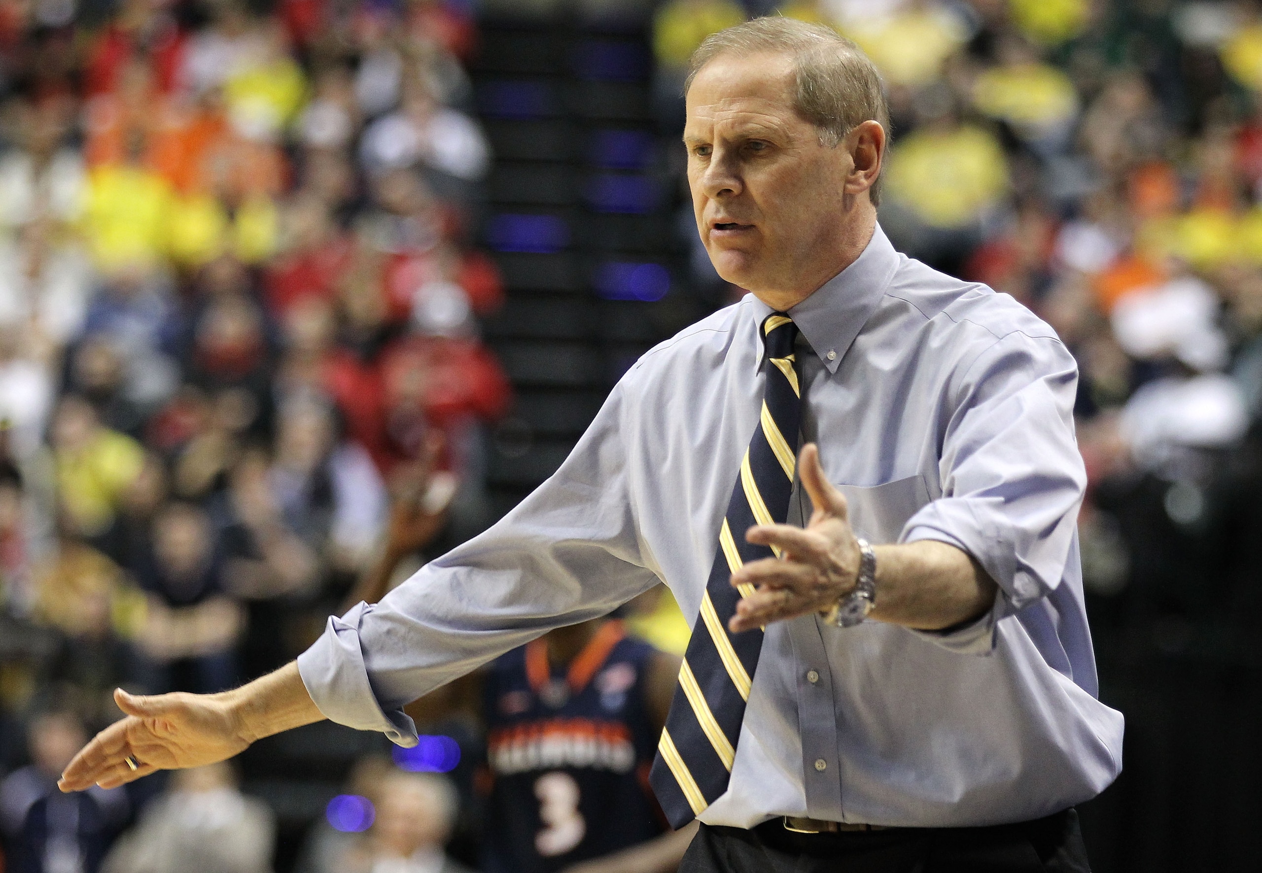 INDIANAPOLIS, IN - MARCH 11:  Head coach John Beilein of the Michigan Wolverines reacts against the Illinois Fighting Illini during the quarterfinals of the 2011 Big Ten Men's Basketball Tournament at Conseco Fieldhouse on March 11, 2011 in Indianapolis,