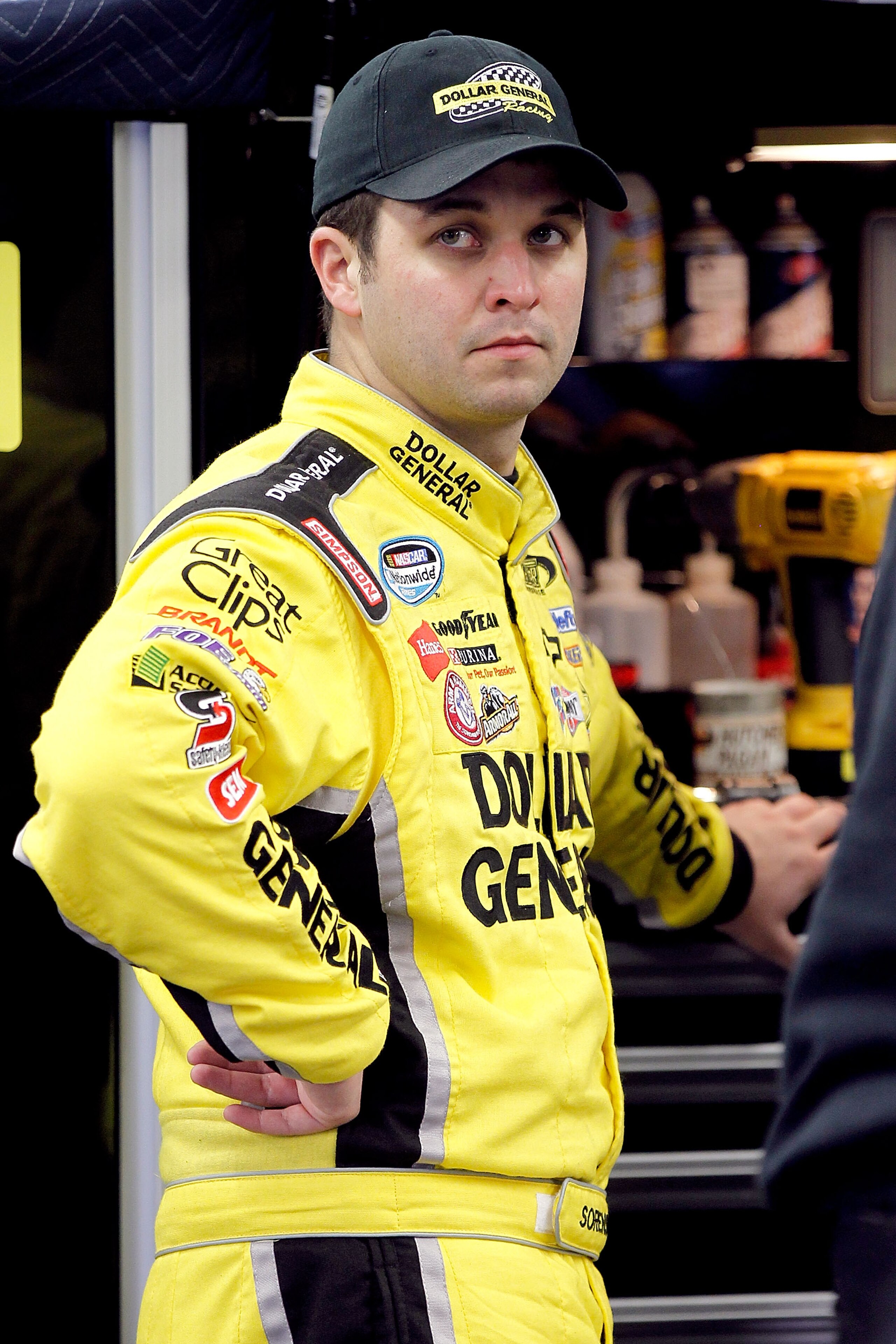 DAYTONA BEACH, FL - FEBRUARY 16:  Reed Sorenson, driver of the #32 Dollar General Toyota, looks on in the garage area during practice for the NASCAR Nationwide Series DRIVE4COPD 300 at Daytona International Speedway on February 16, 2011 in Daytona Beach,