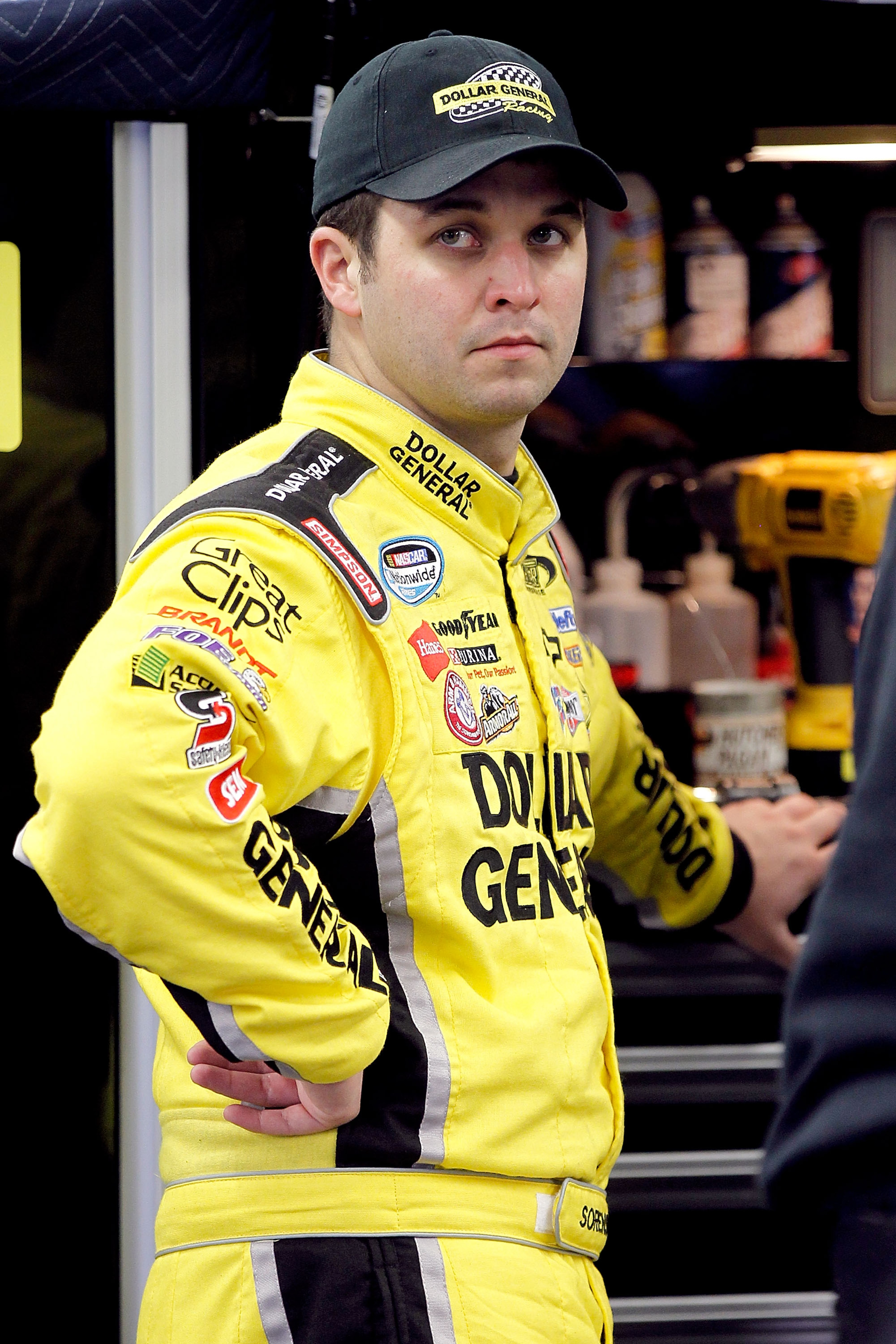 DAYTONA BEACH, FL - FEBRUARY 16:  Reed Sorenson, driver of the #32 Dollar General Toyota, looks on in the garage area during practice for the NASCAR Nationwide Series DRIVE4COPD 300 at Daytona International Speedway on February 16, 2011 in Daytona Beach,