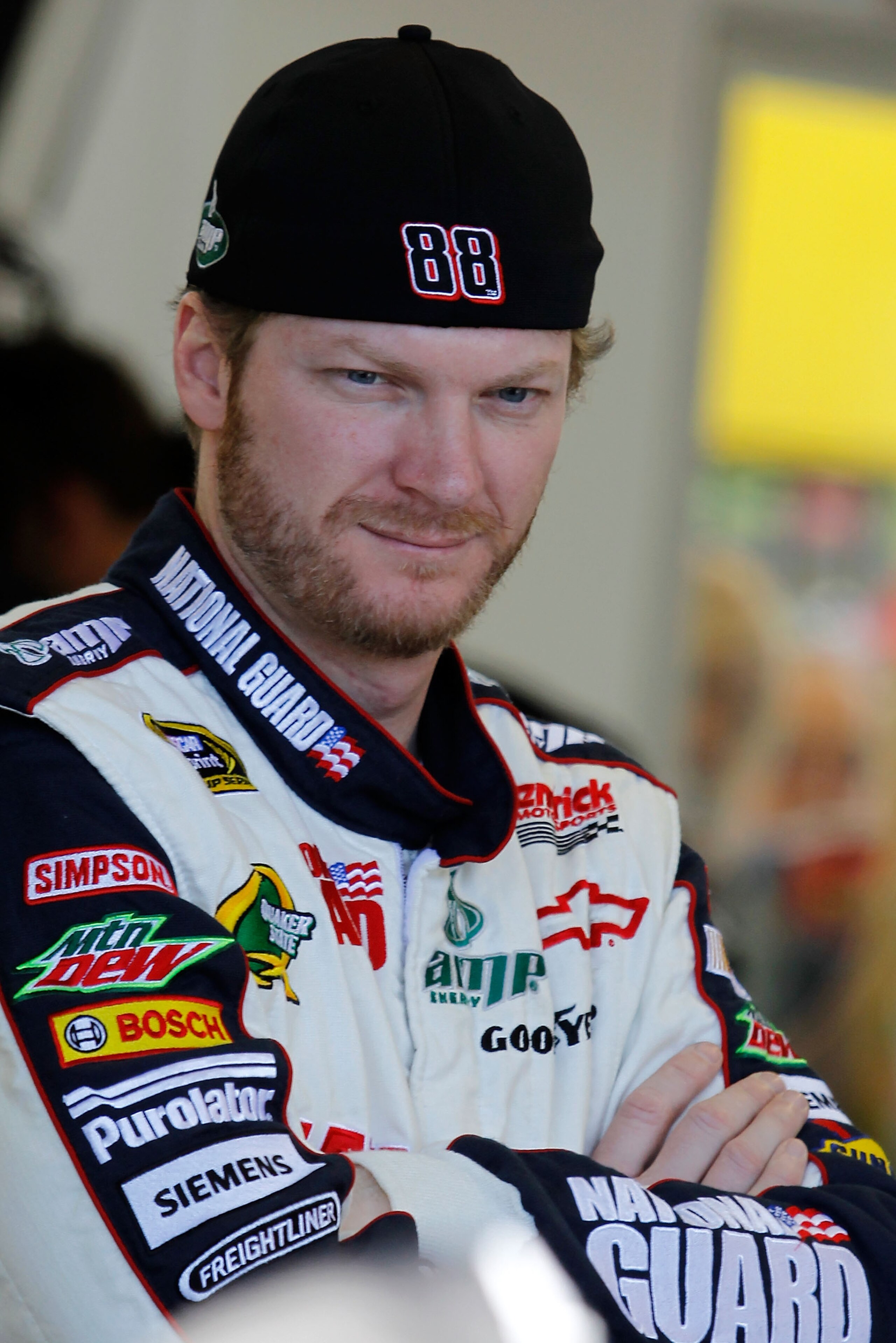 LAS VEGAS, NV - MARCH 04:  Dale Earnhardt Jr., driver of the #88 National Guard/Amp Energy Chevrolet, stands in the garage during practice for the NASCAR Sprint Cup Series Kobalt Tools 400 at Las Vegas Motor Speedway on March 4, 2011 in Las Vegas, Nevada.