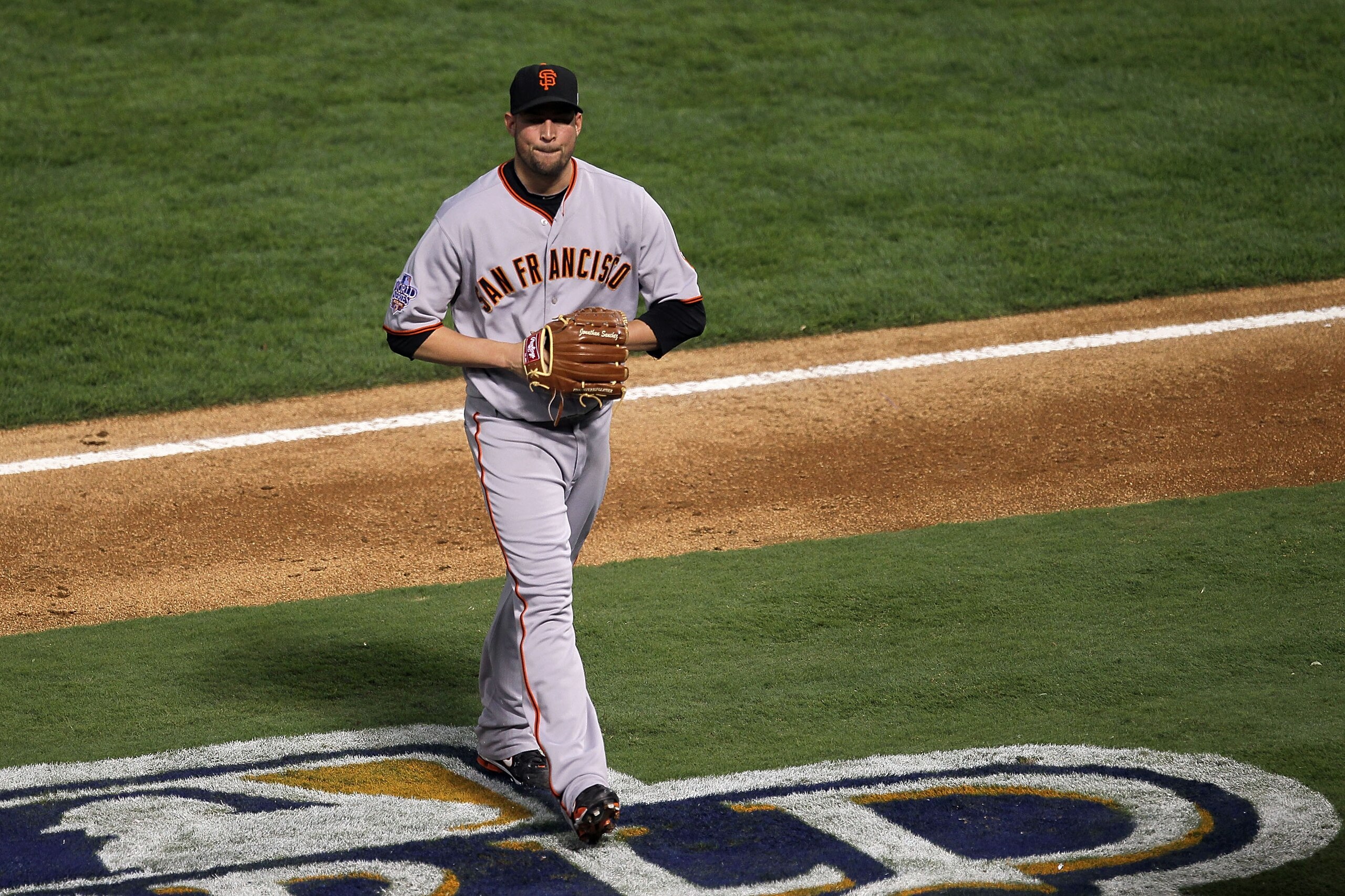 ARLINGTON, TX - OCTOBER 30:  Jonath Sanchez #57 of the San Francisco Giants walks back to the dugout at the end of the second inning against the Texas Rangers in Game Three of the 2010 MLB World Series at Rangers Ballpark in Arlington on October 30, 2010