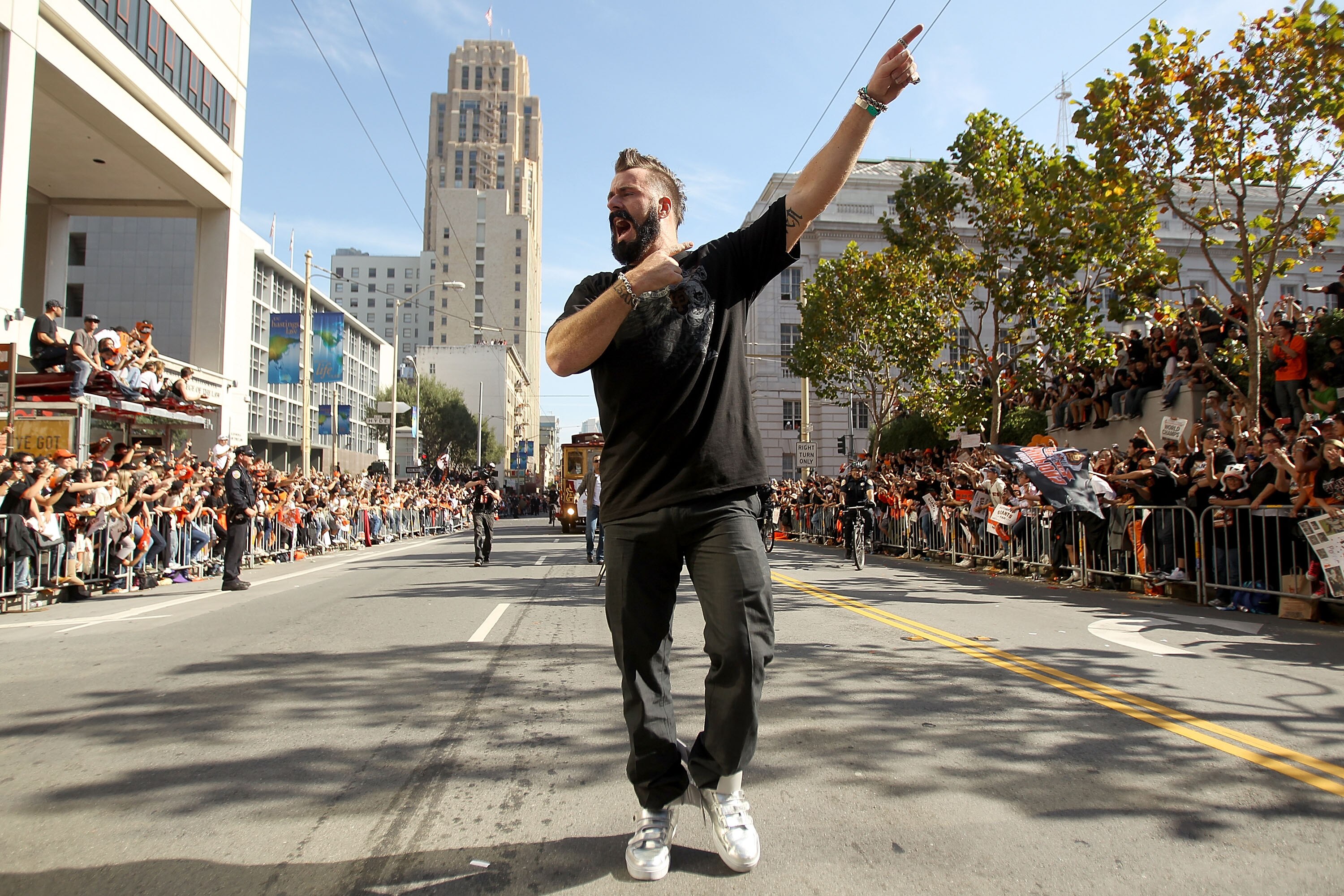 SAN FRANCISCO - NOVEMBER 03:  Pitcher Brian Wilson of the San Francisco Giants walks down the street during the San Francisco Giants victory parade on November 3, 2010 in San Francisco, California.  (Photo by Ezra Shaw/Getty Images)