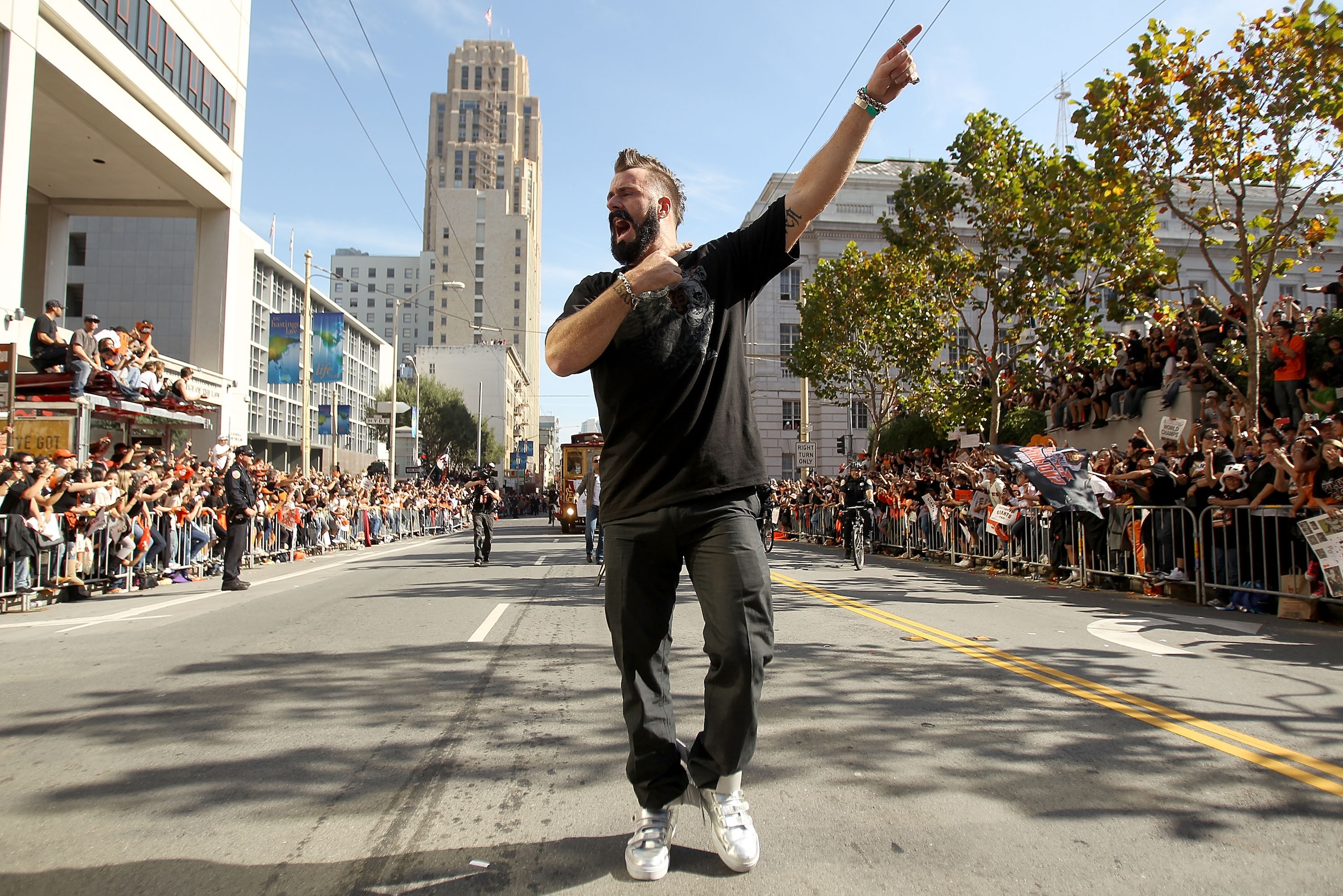 SAN FRANCISCO - NOVEMBER 03:  Pitcher Brian Wilson of the San Francisco Giants walks down the street during the San Francisco Giants victory parade on November 3, 2010 in San Francisco, California.  (Photo by Ezra Shaw/Getty Images)
