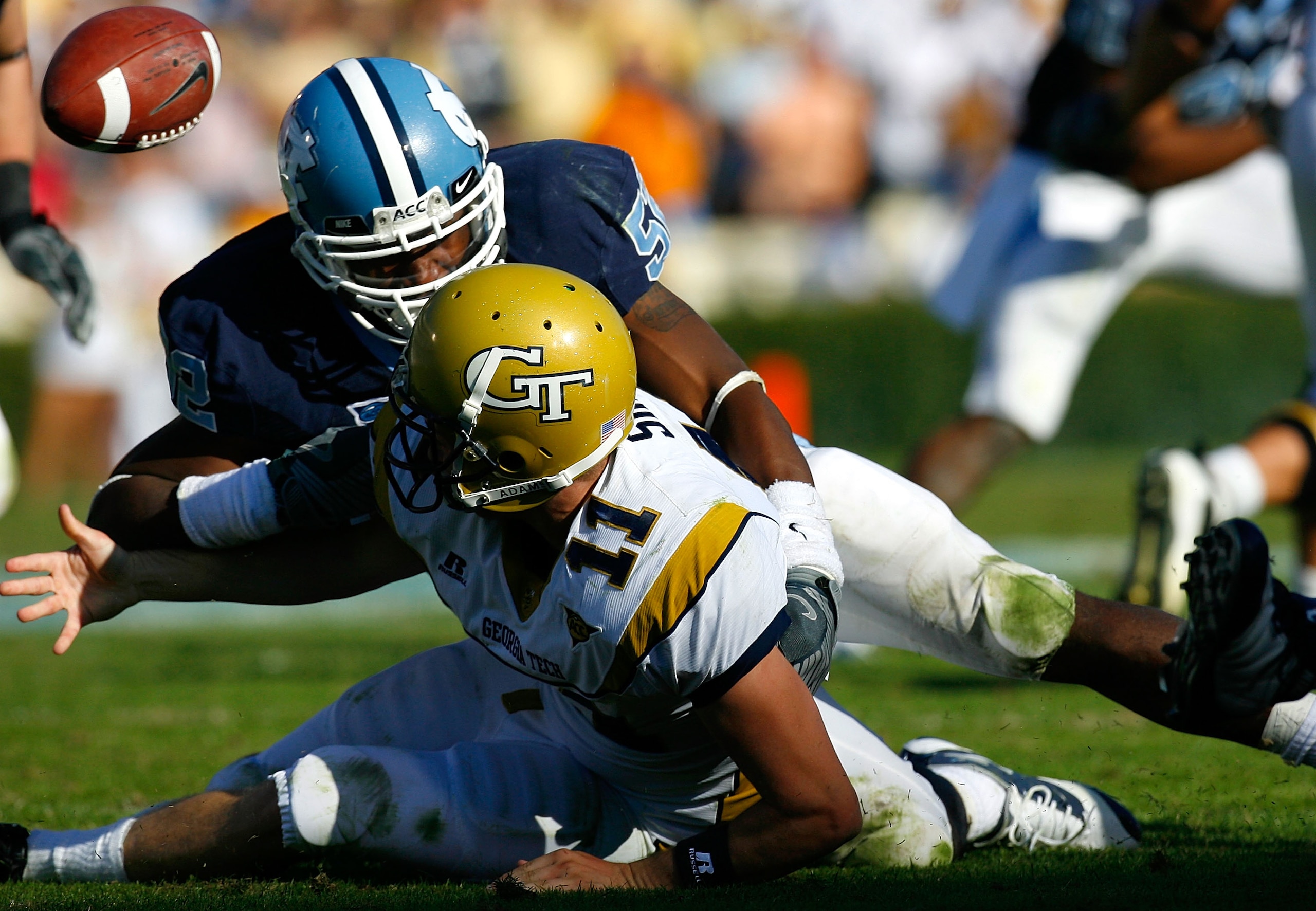 CHAPEL HILL, NC - NOVEMBER 08:  Quan Sturdivant #52 of the North Carolina Tar Heels forces a turnover with this fumble by quarterback Jaybo Shaw #11 of the Georgia Tech Yellow Jackets during the game at Kenan Stadium on November 8, 2008 in Chapel Hill, No