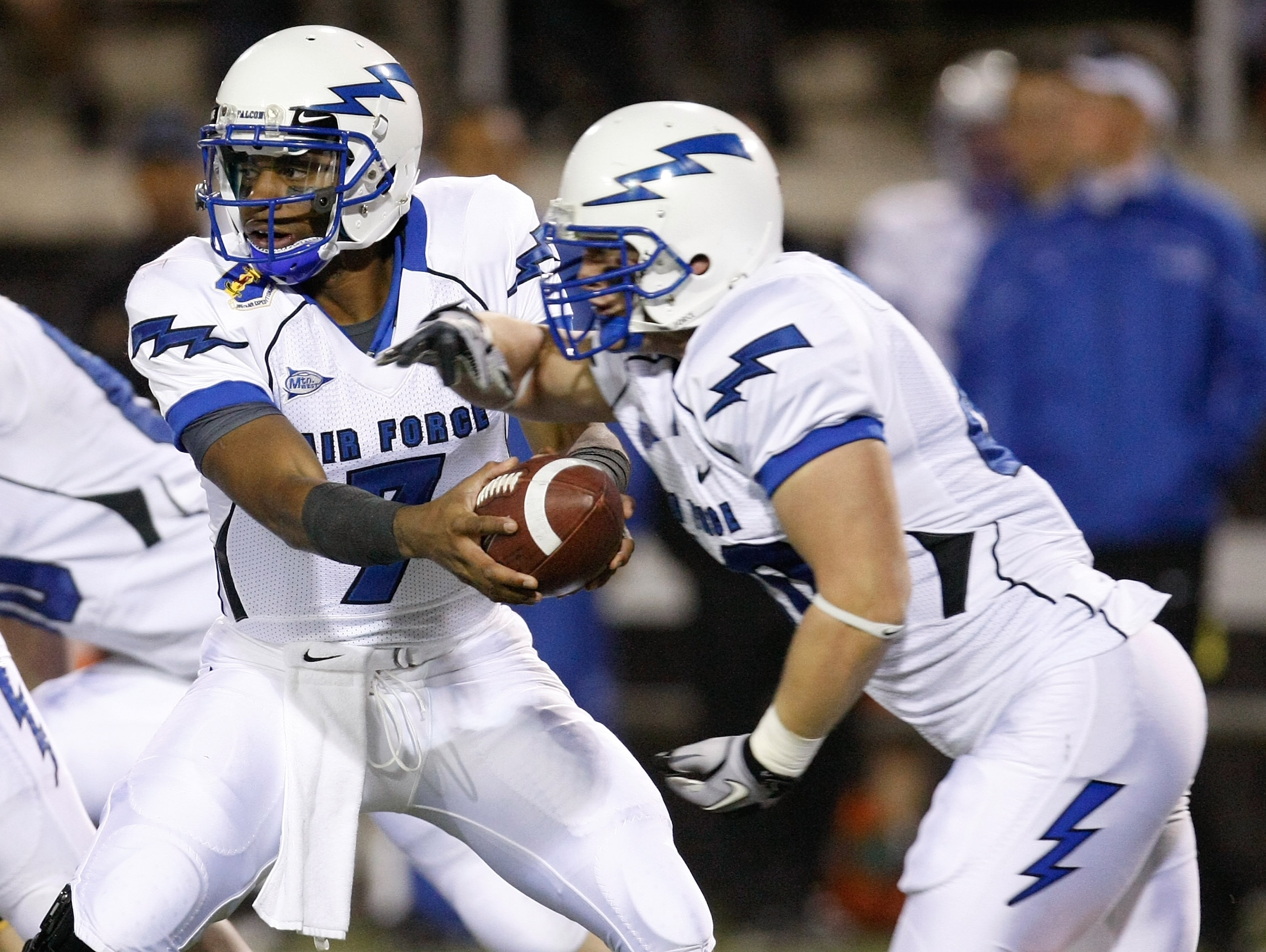 LAS VEGAS - NOVEMBER 18:  Quarterback Tim Jefferson Jr. #7 of the Air Force Falcons hands the ball off to Ryan Southworth #40 during a game against the UNLV Rebels at Sam Boyd Stadium November 18, 2010 in Las Vegas, Nevada. Air Force won 35-20.  (Photo by