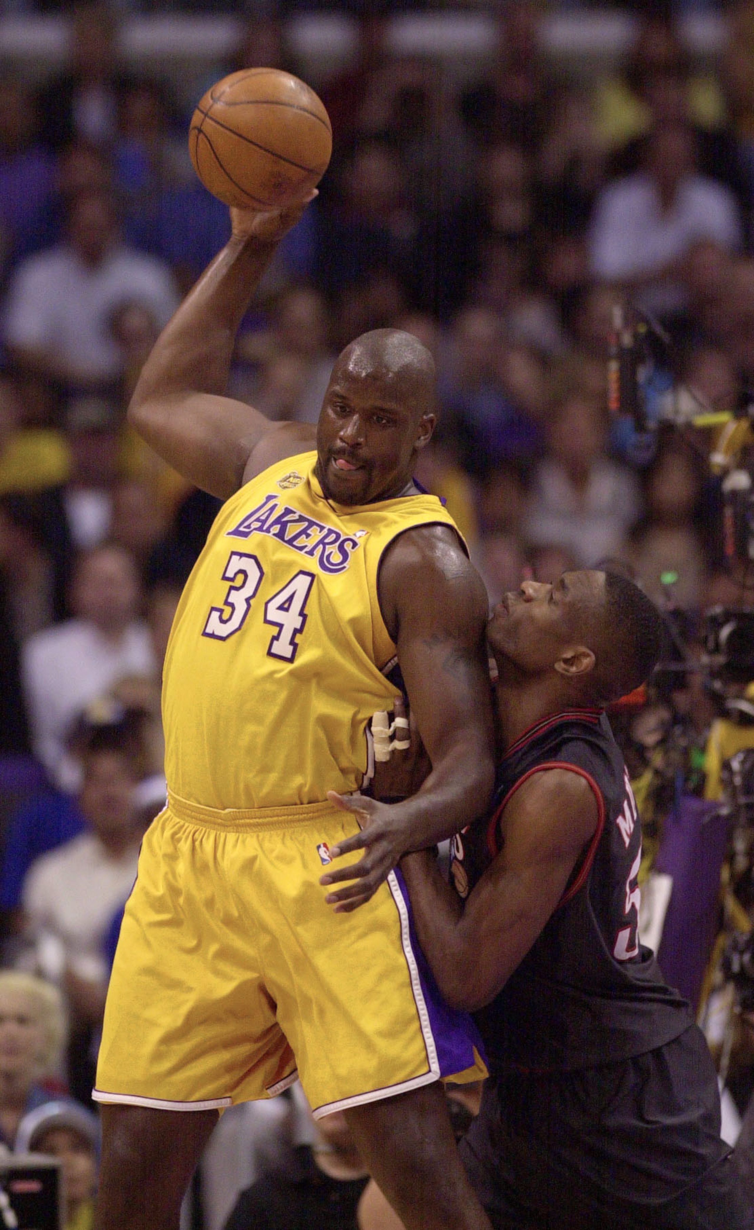 8 Jun 2001:  Shaquille O''Neal #34 of the Los Angeles Lakers posts-up Dikembe Mutombo #55 of the Philadelphia 76ers during Game 2 of the NBA Finals at the Staples Center in Los Angeles, California.  DIGITAL IMAGE Mandatory Credit: Otto Greule/ALLSPORT  NO