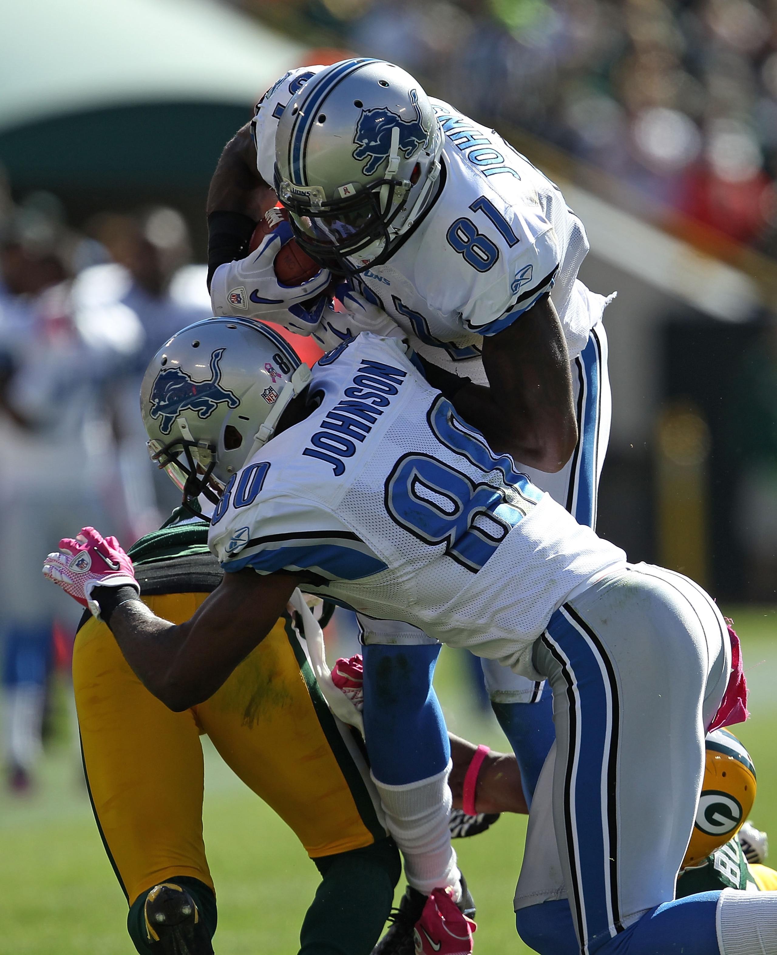 GREEN BAY, WI - OCTOBER 03: Calvin Johnson #81 of the Detroit Lions runs into teammate Bryant Johnson #80 against the Green Bay Packers at Lambeau Field on October 3, 2010 in Green Bay, Wisconsin. The Packers defeated the Lions 28-26.  (Photo by Jonathan