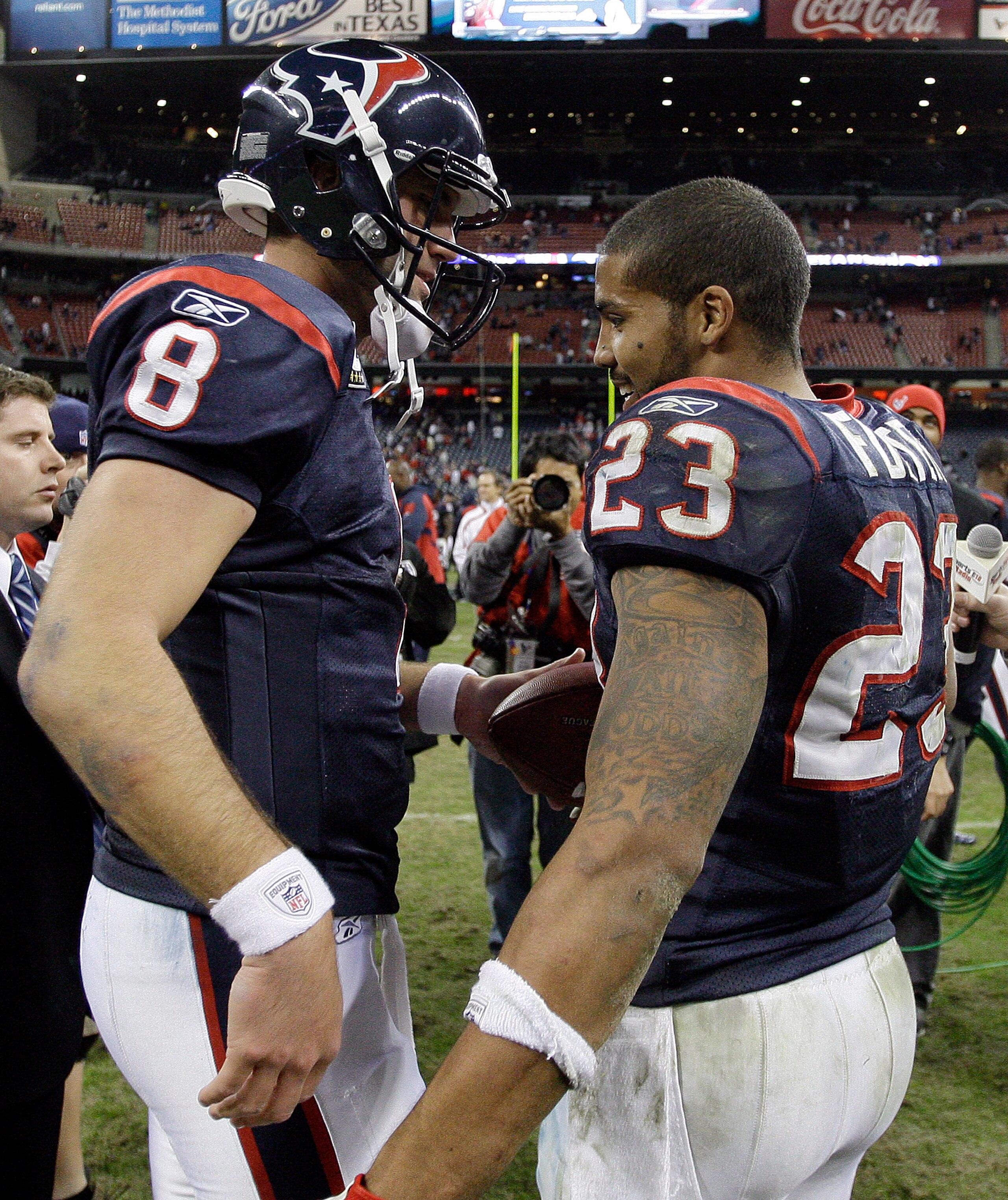 HOUSTON - JANUARY 02:  Quarterback Matt Schaub #8 of the Houston Texans hands running back Arian Foster #23 the game ball after Houston defeated the Jacksonville Jaguars 34-17 at Reliant Stadium on January 2, 2011 in Houston, Texas.  (Photo by Bob Levey/G