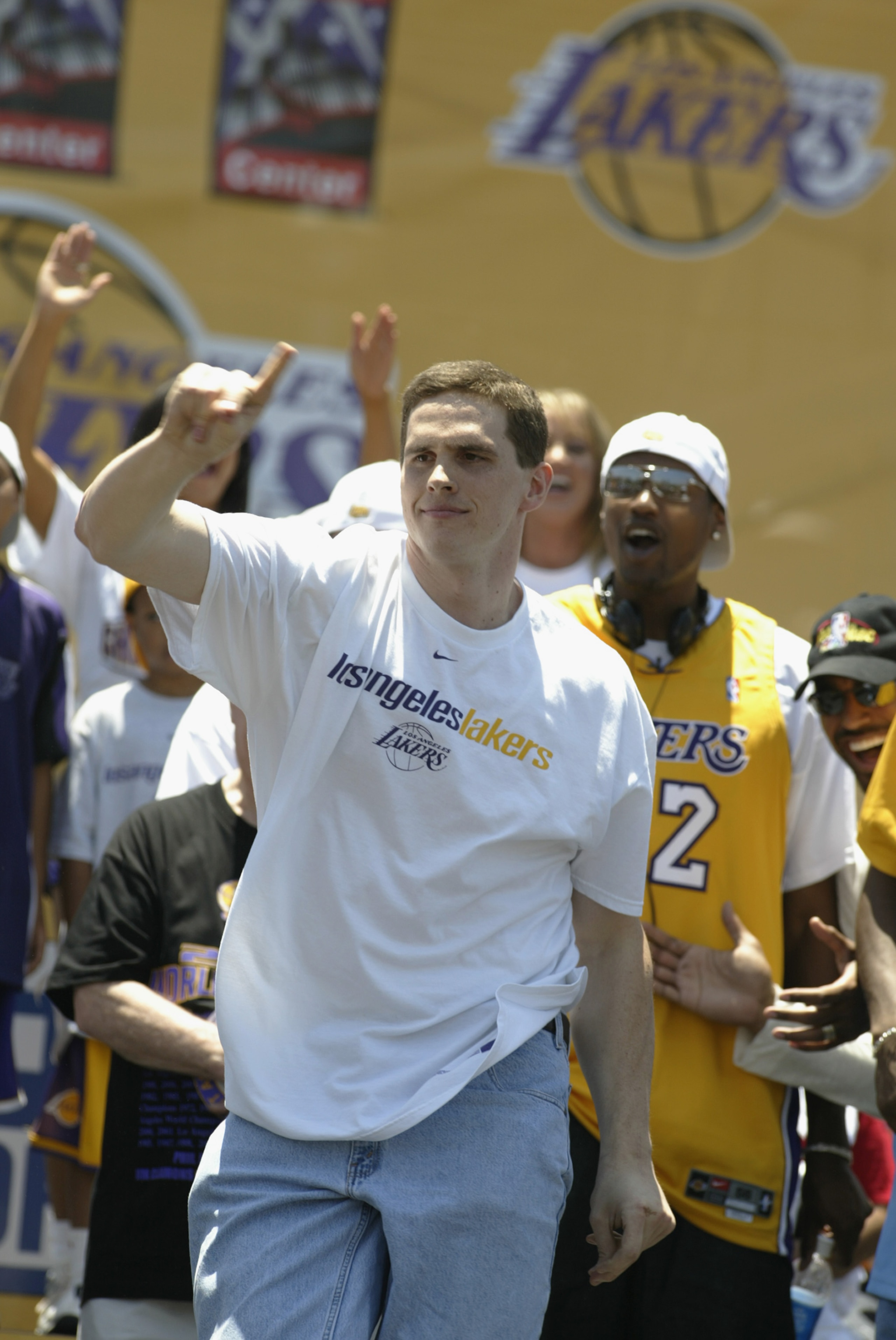 LOS ANGELES - JUNE 14: Mark Madsen #35 of the Los Angeles Lakers dances on stage in downtown Los Angeles following the victory parade on June 14, 2002 at Staples Center in Los Angeles, California.  The Lakers won their third consecutive NBA Championship t