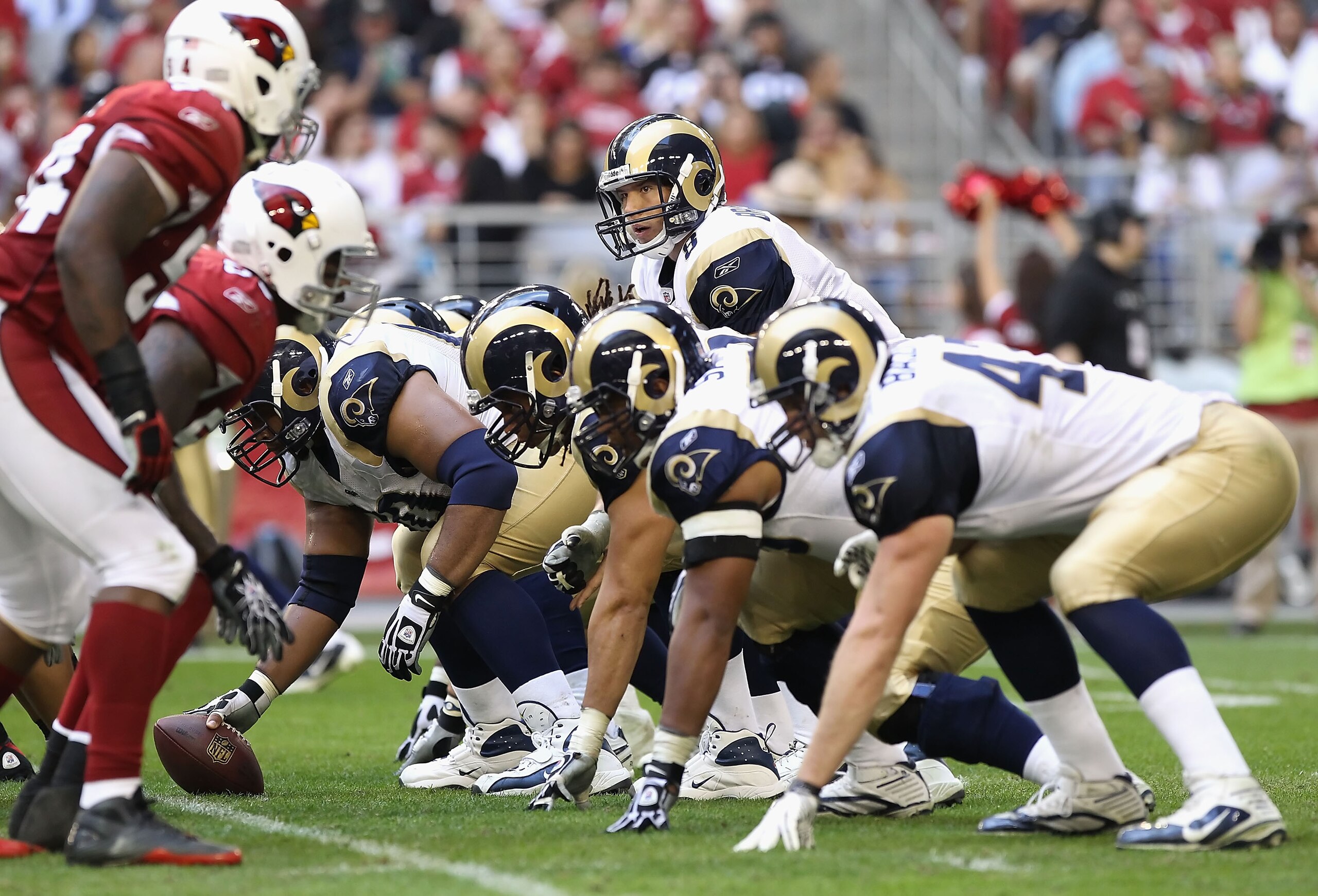 GLENDALE, AZ - DECEMBER 05:  Quarterback Sam Bradford #8 of the St. Louis Rams snaps the football during the NFL game against the Arizona Cardinals at the University of Phoenix Stadium on December 5, 2010 in Glendale, Arizona. The Rams defeated the Cardin