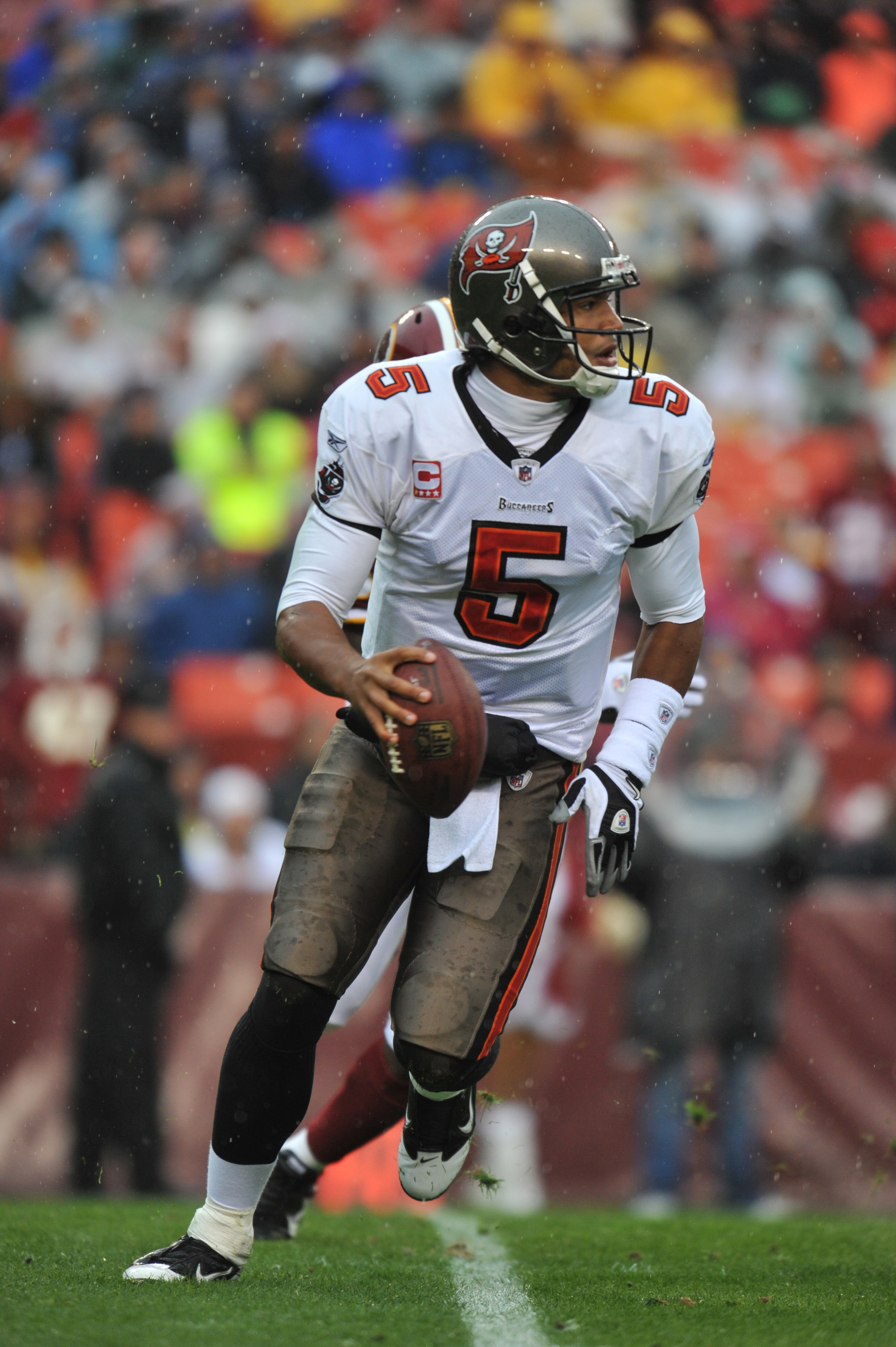 LANDOVER, MD - DECEMBER 12:  Josh Freeman #5 of the Tampa Bay Buccaneers scrambles during the game against the Washington Redskins  at FedExField on December 12, 2010 in Landover, Maryland. The Buccaneers defeated the Redskins 17-16. (Photo by Larry Frenc