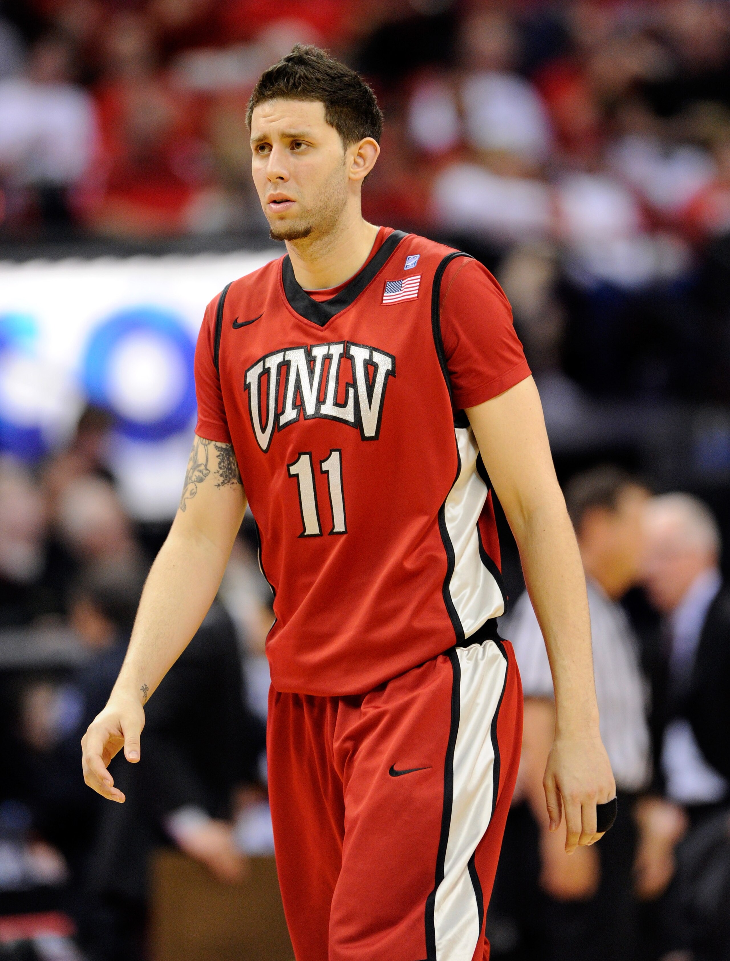 LAS VEGAS, NV - MARCH 11:  Carlos Lopez #11 of the UNLV Rebels appears on the court during a semifinal game of the Conoco Mountain West Conference Basketball tournament against the San Diego State Aztecs at the Thomas & Mack Center March 11, 2011 in Las V