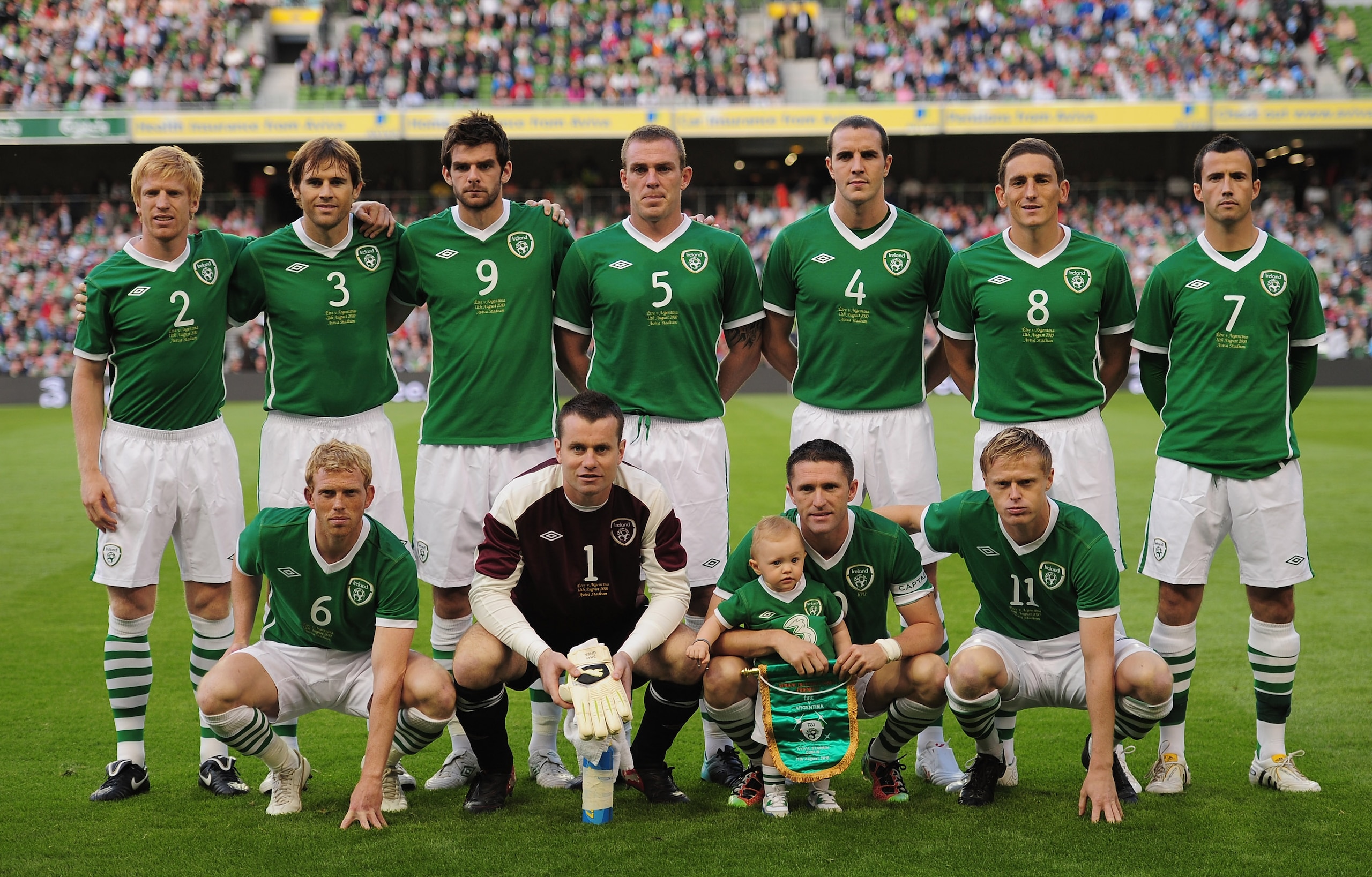 DUBLIN, IRELAND - AUGUST 11:  Robbie Keane the Republic of Ireland captain poses with his son Robert and the Republic of Ireland team as he makes his 100th appearance during the International Friendly match between Republic of Ireland and Argentina at the