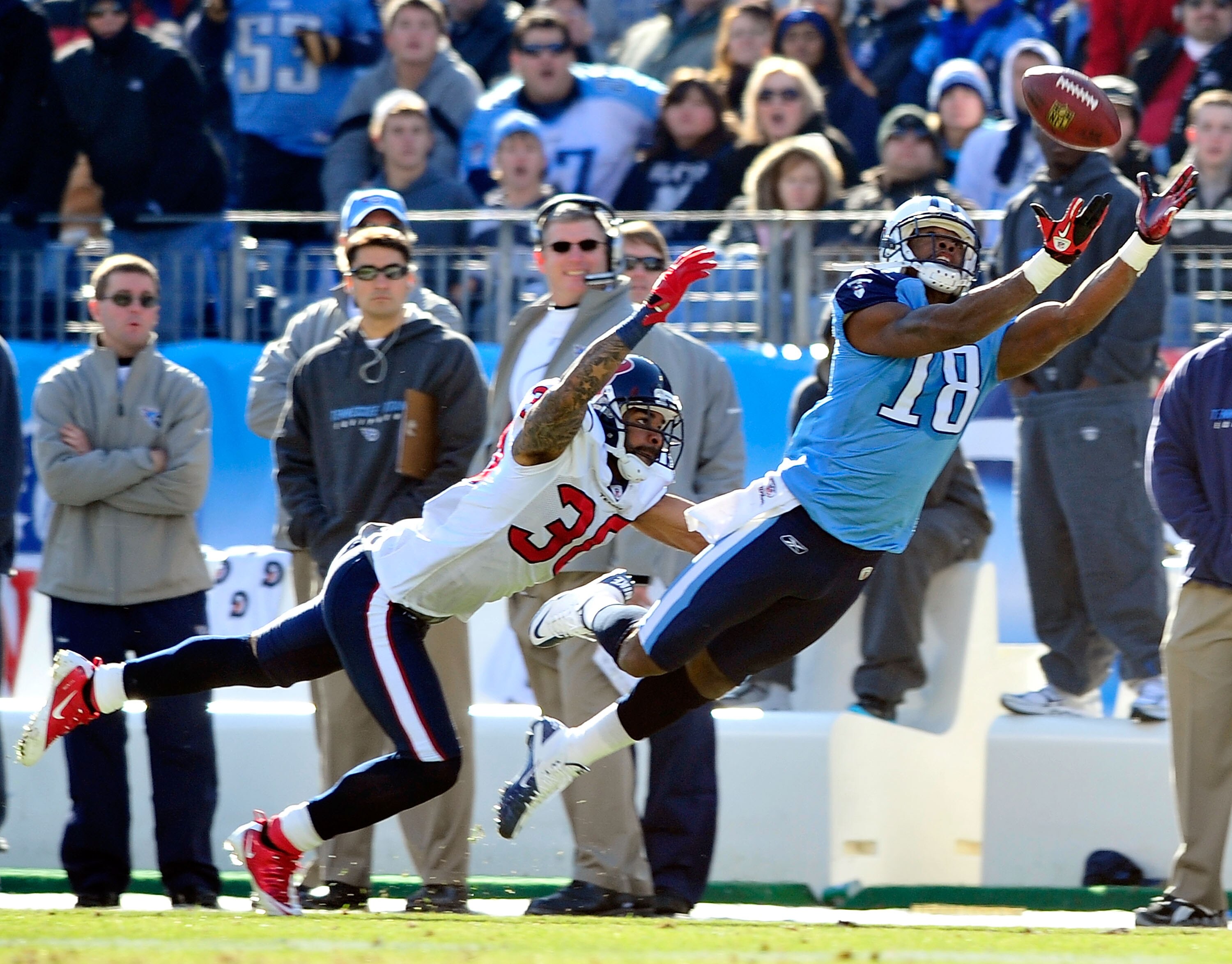 NASHVILLE, TN - DECEMBER 19:  Jason Allen #20 of the Houston Texans defends a pass to Kenny Britt #18 of the Tennessee Titans  during the first half at LP Field on December 19, 2010 in Nashville, Tennessee.  (Photo by Grant Halverson/Getty Images)