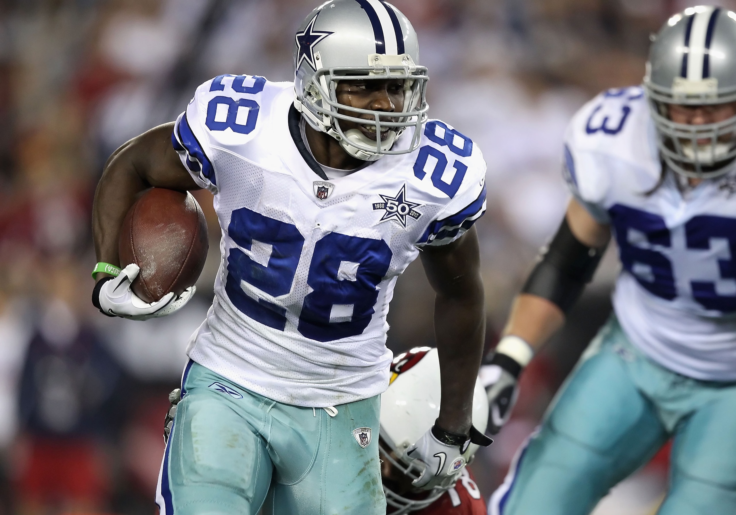 GLENDALE, AZ - DECEMBER 25:  Runningback Felix Jones #28 of the Dallas Cowboys rushes the football during the NFL game against the Arizona Cardinals at the University of Phoenix Stadium on December 25, 2010 in Glendale, Arizona.  The Cardinals defeated th