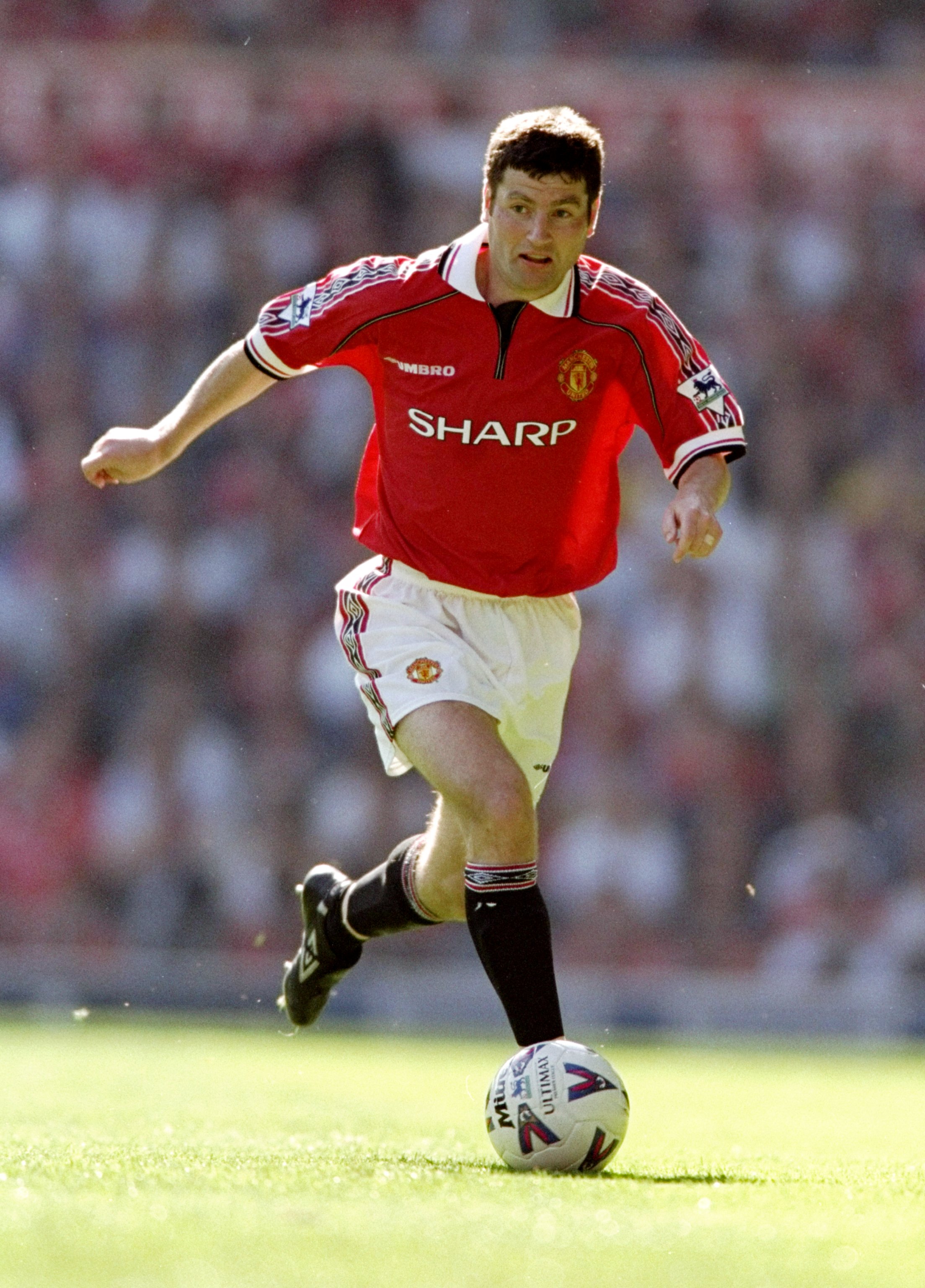 15 Aug 1998: Denis Irwin of Manchester United in action during the FA Carling Premiership match against Leicester City at Old Trafford in Manchester, England. The game ended 2-2. \ Mandatory Credit: Shaun Botterill /Allsport