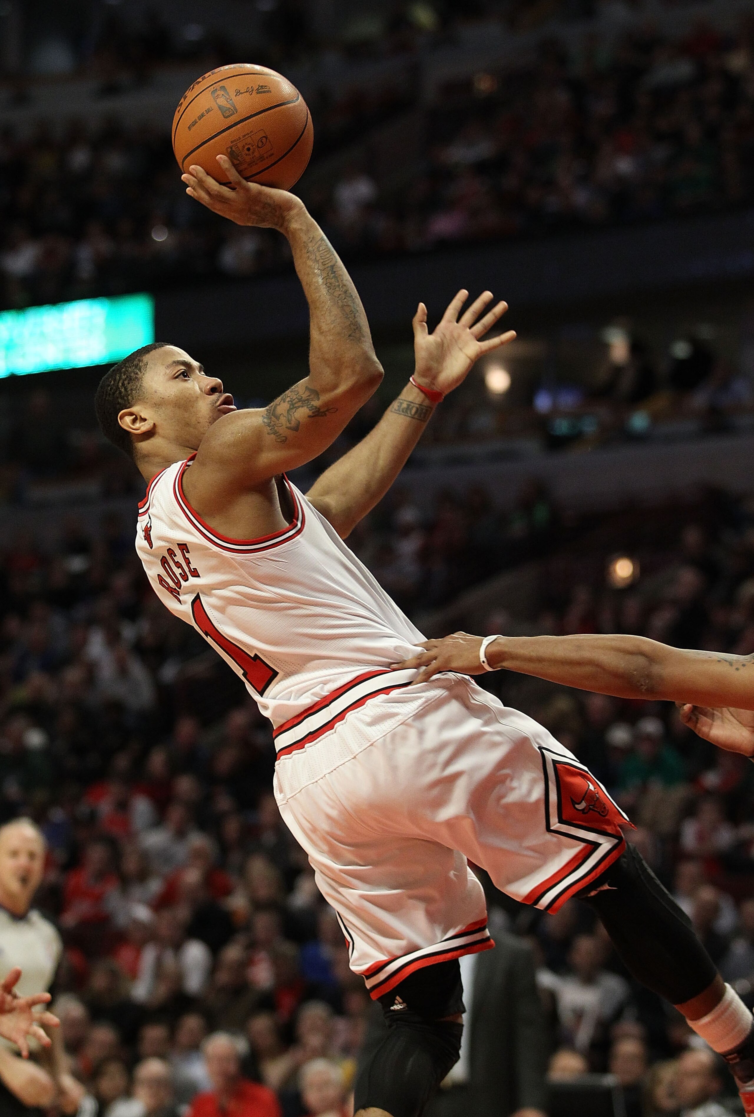 CHICAGO, IL - MARCH 12: Derrick Rose #1 of the Chicago Bulls puts up a shot against the Utah Jazz at the United Center on March 12, 2011 in Chicago, Illinois. The Bulls defeated the Jazz 118-100. NOTE TO USER: User expressly acknowledges and agrees that,