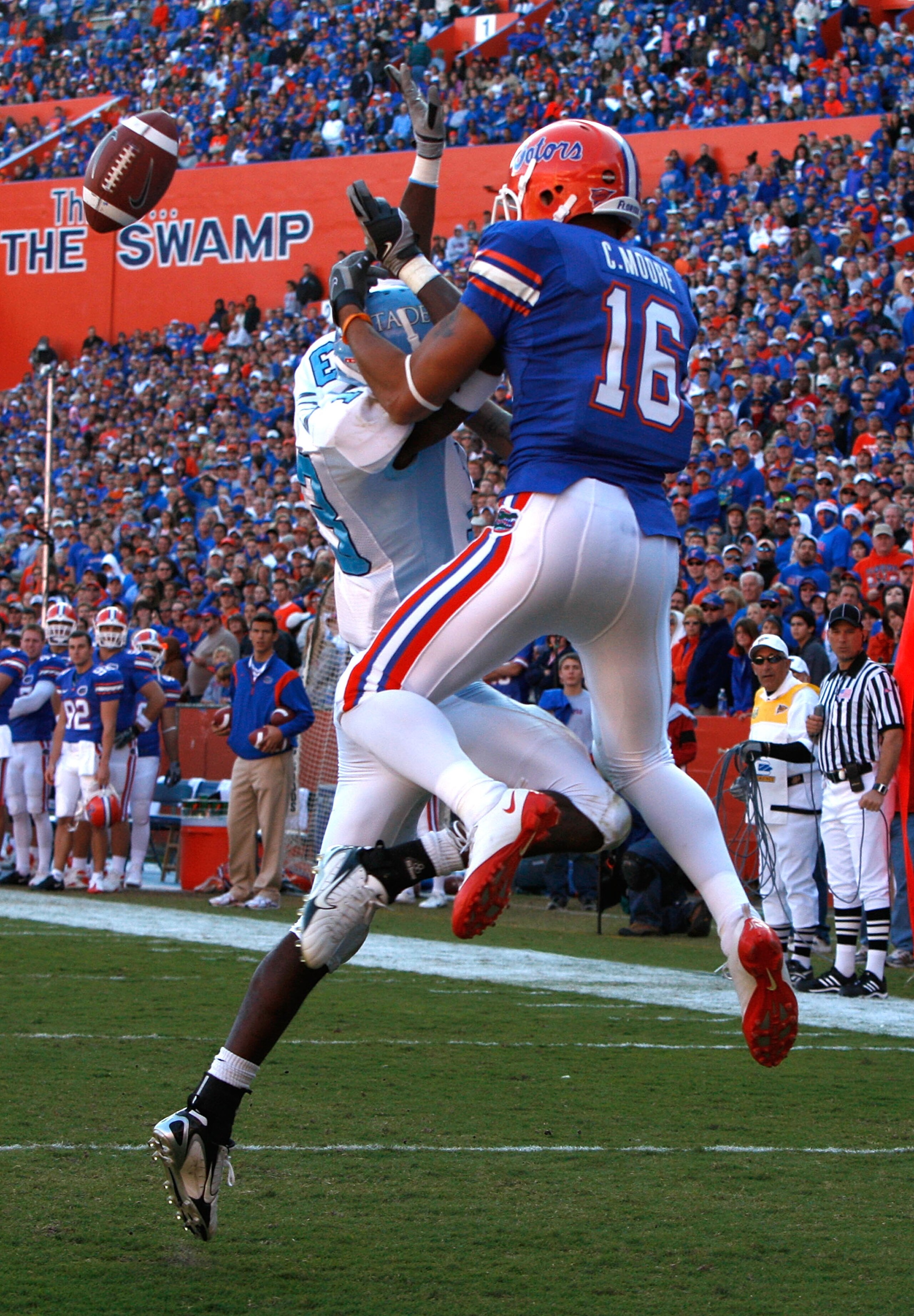 GAINESVILLE, FL - NOVEMBER 22:  Carl Moore #16 of the Florida Gators catches a pass against Cortez Allen #13 of the Citadel Bulldogs during the game at Ben Hill Griffin Stadium on November 22, 2008 in Gainesville, Florida.  (Photo by Sam Greenwood/Getty I