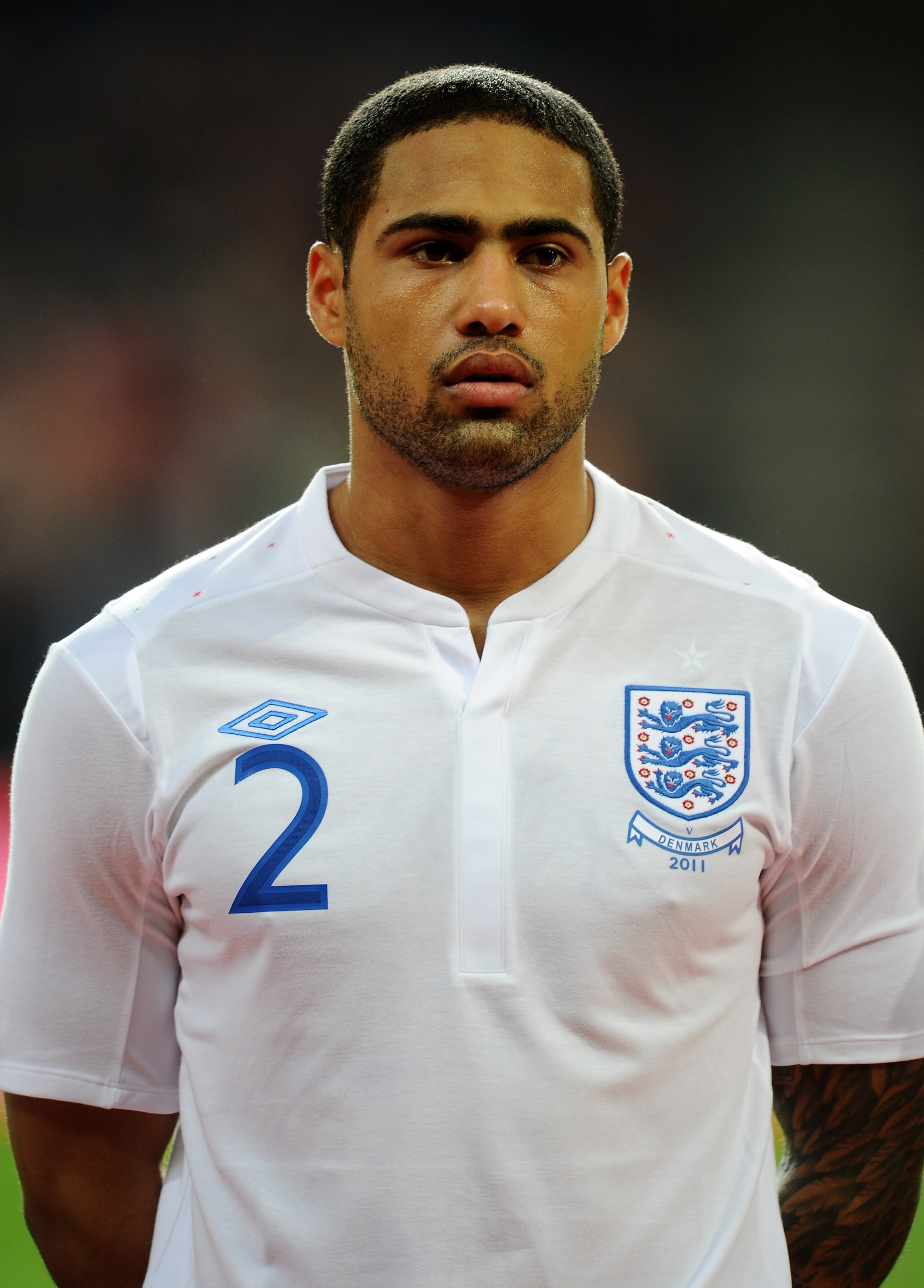 COPENHAGEN, DENMARK - FEBRUARY 09:  Glen Johnson of England stands for the national anthems prior to the International Friendly match between Denmark and England at Parken Stadium on February 9, 2011 in Copenhagen, Denmark.  (Photo by Mike Hewitt/Getty Im
