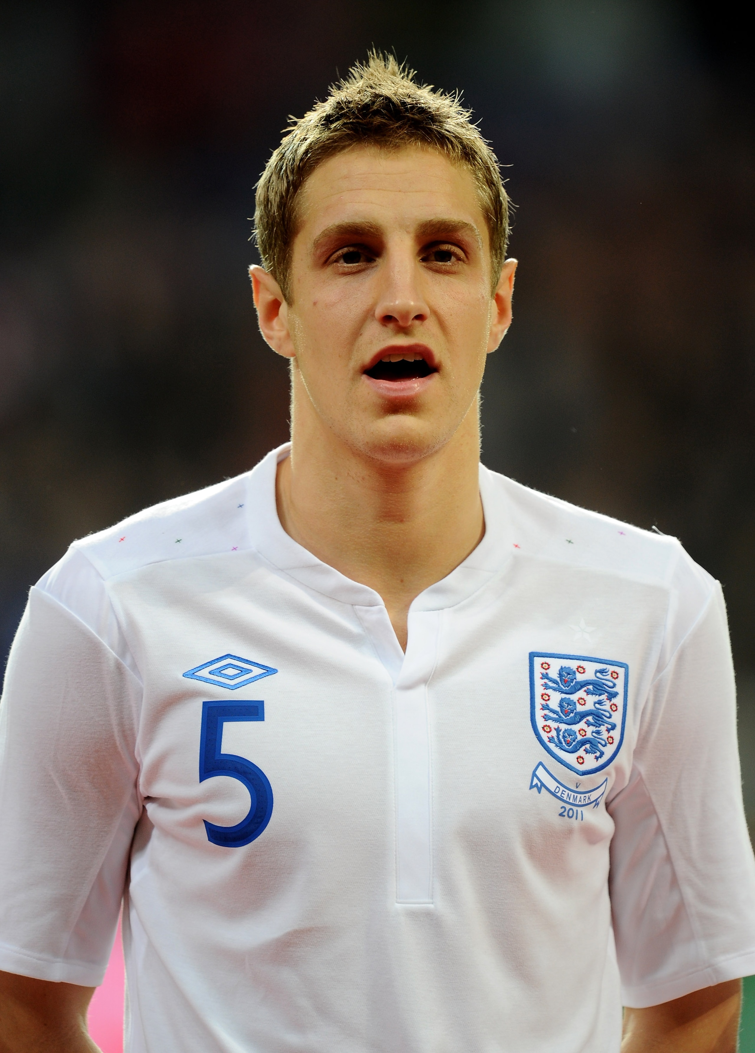 COPENHAGEN, DENMARK - FEBRUARY 09:  Michael Dawson of England stands for the national anthems prior to the International Friendly match between Denmark and England at Parken Stadium on February 9, 2011 in Copenhagen, Denmark.  (Photo by Mike Hewitt/Getty 