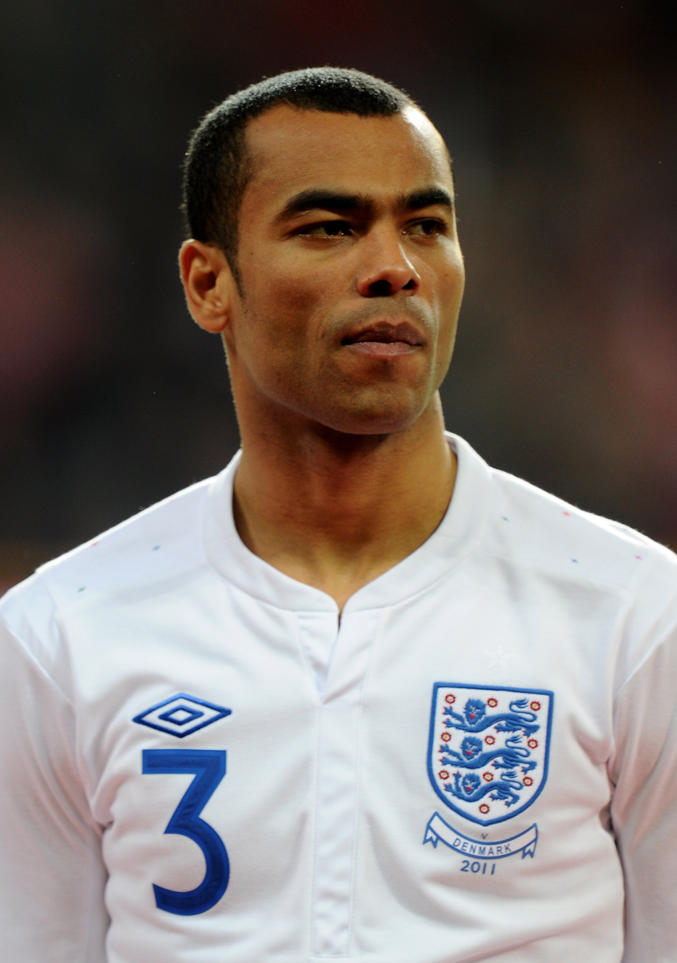 COPENHAGEN, DENMARK - FEBRUARY 09:  Ashley Cole of England stands for the national anthems prior to the International Friendly match between Denmark and England at Parken Stadium on February 9, 2011 in Copenhagen, Denmark.  (Photo by Mike Hewitt/Getty Ima