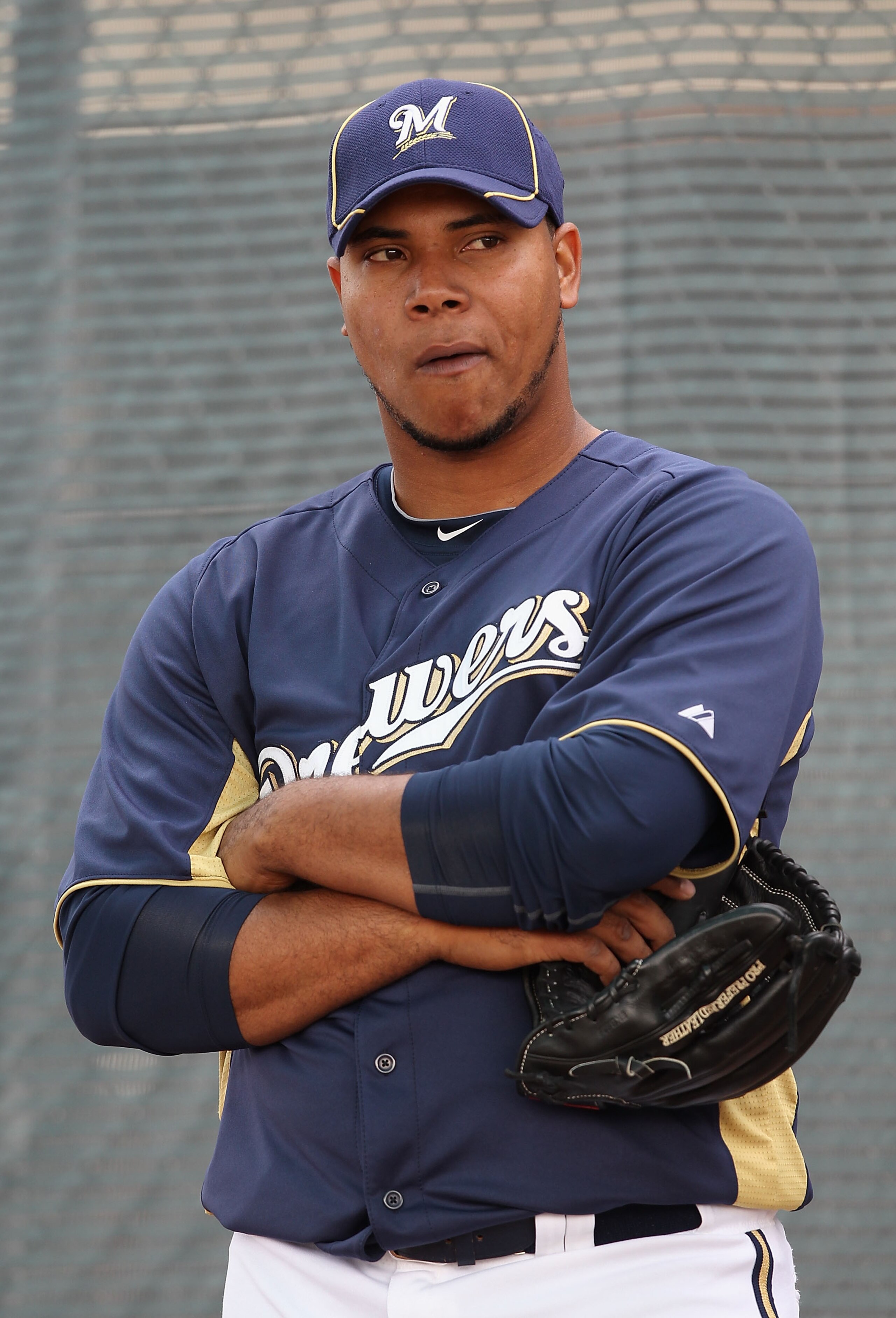 PHOENIX, AZ - FEBRUARY 18:  Pitcher Wily Peralta #73 of the Milwaukee Brewers listens to coaches during a MLB spring training practice at Maryvale Baseball Park on February 18, 2011 in Phoenix, Arizona.  (Photo by Christian Petersen/Getty Images)