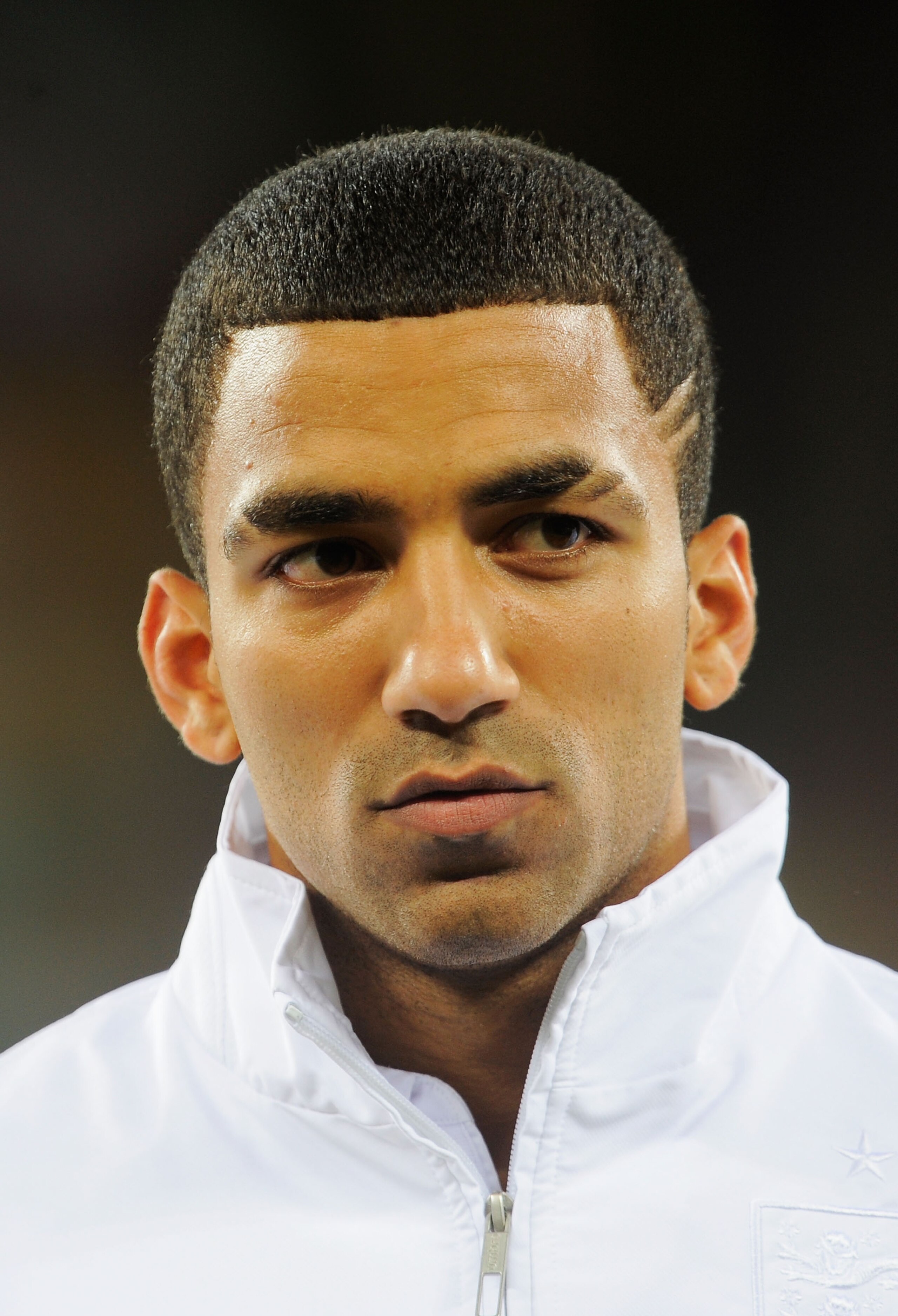 CAPE TOWN, SOUTH AFRICA - JUNE 18:  Aaron Lennon of England lines up for the national anthems prior to the 2010 FIFA World Cup South Africa Group C match between England and Algeria at Green Point Stadium on June 18, 2010 in Cape Town, South Africa.  (Pho